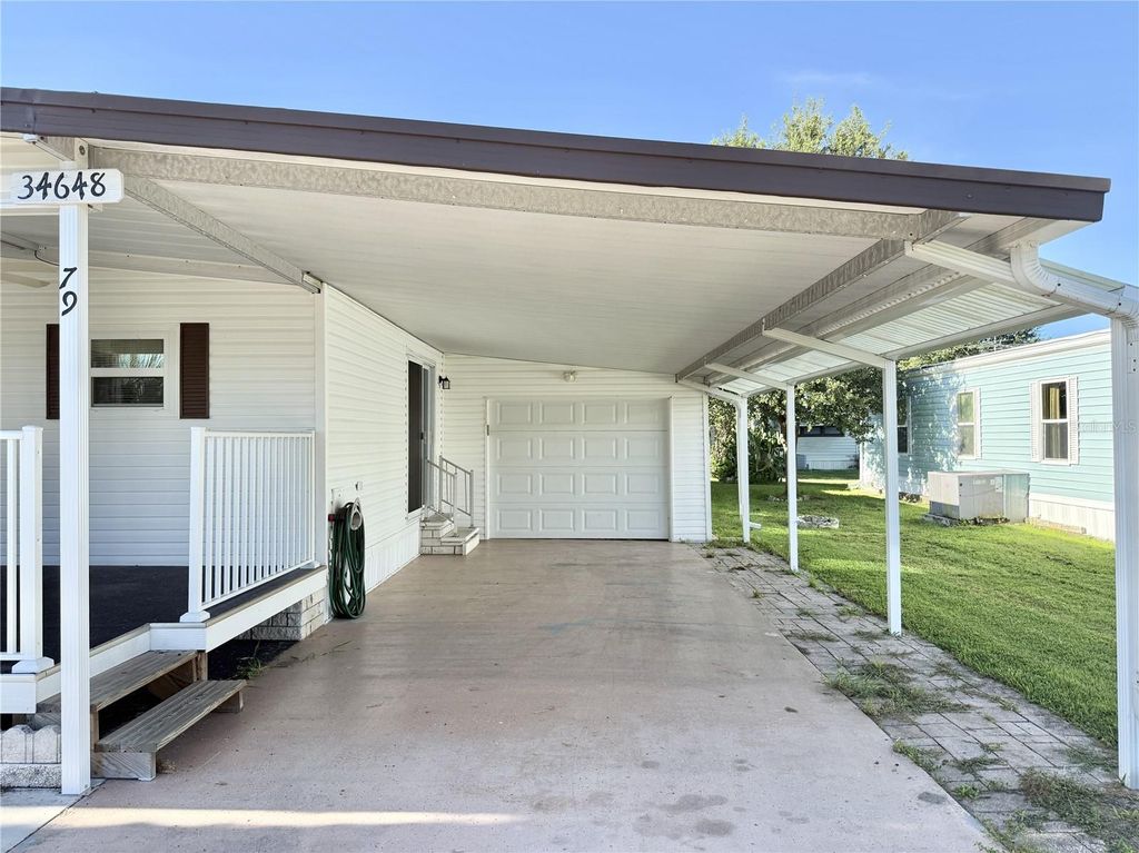 Photo of 34648 Sweetpea Lane, Zephyrhills, FL 33541 (MLS # TB8417789)