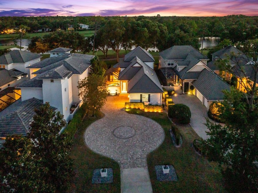 Now positioned as one of the most compelling values within Lake Nona Golf & Country Club, this residence offers a rare opportunity to enjoy wide-water and golf course views at a rare entry point for this setting.

Wake up to serene wide-water views and wind down with striking sunsets over the 4th hole. Ideally positioned to capture the scenery while set safely back from play, the home offers a front-row setting with a natural sense of separation.

Within one of the world’s most celebrated private club communities, residents enjoy access to a Tom Fazio–designed championship course known for its strategic layout, pristine conditioning, and enduring playability—one members never tire of.

Designed for effortless indoor-outdoor living, two sets of LaCantina accordion doors extend the home’s main living spaces to the courtyard pool and expansive screened lanai, creating a seamless connection between inside and out. Natural light fills the interiors, emphasizing an inviting layout suited for relaxed everyday living and comfortable entertaining. The screened lanai provides a shaded vantage point overlooking the golf course, while the private courtyard pool offers a quiet retreat for cooling off and unwinding in privacy.
 
The spacious kitchen blends clean, modern style with everyday functionality, featuring ample cabinet space, sleek countertops, and a suite of Bosch appliances, including double ovens, an induction cooktop, and a dishwasher, along with a built-in wine fridge. This well-appointed space supports both casual dining and effortless entertaining.
 
Thoughtfully designed for livability, the floor plan includes four bedrooms and 3.5 baths, with a flexible half bath that can be converted back to a full bath if desired. Upstairs, the primary suite includes dual closets and an adjoining den—ideal for a home office, reading lounge, or personal retreat. Step out onto the large private balcony to enjoy elevated views across the water and fairway, creating a picturesque setting to start or end each day. A generous secondary bedroom upstairs features its own ensuite bath and walk-in closet, while two additional bedrooms on the main level offer flexibility for guests.  
 
The nearly half acre lot carries meaningful long-term potential - whether to expand the existing residence or build a larger custom  home.   The home's positioning well back from the road offers a distinct sense of arrival along with enhanced privacy, all framed by low-maintenance landscaping designed for easy living.
 
Enjoy the convenience of a golf cart lifestyle with direct access to the club’s exceptional amenities, including golf, racquet sports, fitness, dining, and a vibrant calendar of social events. Here, luxury meets community within one of Central Florida’s most sought-after private enclaves.