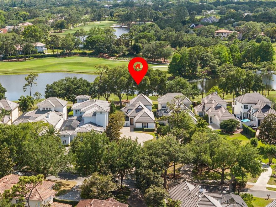 Wake up to serene wide-water views and wind down with striking sunsets over the 4th hole of Lake Nona Golf & Country Club. Ideally positioned to capture the scenery while set safely back from play, this residence offers a front-row golf course lifestyle balanced with privacy and ease.
 
Nestled within one of the world's most celebrated private club communities, residents enjoy access to a Tom Fazio–designed championship course celebrated for its strategic layout, pristine conditioning, and enduring playability. It’s a course members and guests never tire of—rewarding and enjoyable for players of every skill level.
 
Designed for effortless indoor-outdoor living, two sets of LaCantina accordion doors extend the home’s main living spaces to the courtyard pool and expansive screened lanai, creating a seamless connection between inside and out. Natural light fills the interiors, emphasizing an inviting layout suited for relaxed everyday living and comfortable entertaining. The screened lanai provides a shaded vantage point overlooking the golf course, while the private courtyard pool offers a quiet retreat for cooling off and unwinding in privacy.
 
The spacious kitchen blends clean, modern style with everyday functionality, featuring ample cabinet space, sleek countertops, and a suite of Bosch appliances, including double ovens, an induction cooktop, and a dishwasher, along with a built-in wine fridge. This well-appointed space supports both casual dining and effortless entertaining.
 
Thoughtfully designed for livability, the floor plan includes four bedrooms and 3.5 baths, with a flexible half bath that can be converted back to a full bath if desired. Upstairs, the primary suite includes dual closets and an adjoining den—ideal for a home office, reading lounge, or personal retreat. Step out onto the large private balcony to enjoy elevated views across the water and fairway, creating a picturesque setting to start or end each day. A generous secondary bedroom upstairs features its own ensuite bath and walk-in closet, while two additional bedrooms on the main level offer flexibility for guests.  
 
The nearly half acre lot carries meaningful long-term potential - whether to expand the existing residence or build a larger custom  home.   The home's positioning well back from the road offers a distinct sense of arrival along with enhanced privacy, all framed by low-maintenance landscaping designed for easy living.
 
Enjoy the convenience of a golf cart lifestyle with direct access to the club’s exceptional amenities, including golf, racquet sports, fitness, dining, and a vibrant calendar of social events. Here, luxury meets community within one of Central Florida’s most sought-after private enclaves.