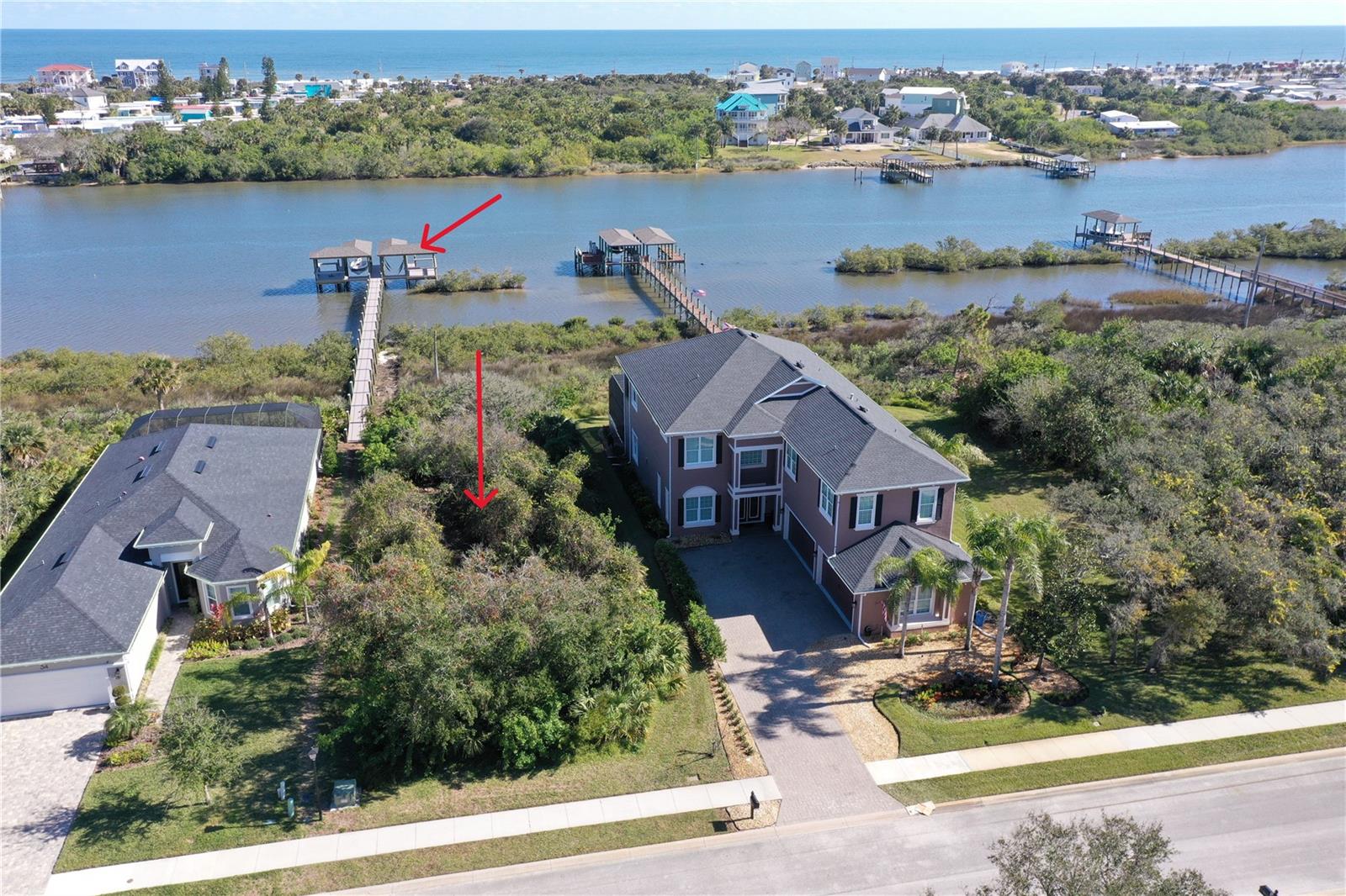 DIRECT INTRACOASTAL HOMESITE WITH NEW DOCK - Build your dream home on this prime homesite on Florida's Intracoastal Waterway with 60’ of direct ICW access and 2024 dock with covered boathouse. The dock approvals and permitting process is over two years – avoid the wait and enjoy your salt-life now! The dock and boat house offers water and electric with 10,000 pound lift. The desirable eastern rear exposure offers amazing sunrises and ocean breezes. Palm Coast Plantation offers a lifestyle where casual luxury, active living, salt-life and nature’s wildlife combine. Enjoy world class amenities – offering water aerobics in the resort-style pool, gym, walk the nature trail, tennis/pickleball, bocce, shuffleboard, horseshoes, basketball, clubhouse and more! Private boat ramp and dock to access Emerald Lake as well. RV and boat storage. No CDD. Just minutes to Flagler Beach with a vibrant atmosphere with local restaurants and live music.