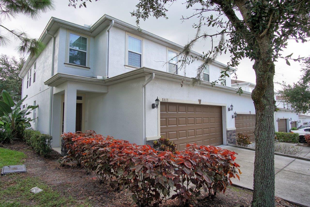 Welcome home—your search is over! This spacious 3-bedroom corner townhome in the relaxing community of Marbella Terrace offers over 2,050 sq. ft. of living space, soaring ceilings, and a 2-car garage. The open first floor features ceramic tile throughout, a bright living area with sliding doors to your screened lanai, and a stylish kitchen with granite countertops, tile backsplash, 42” espresso cabinets, pendant lighting, and stainless-steel appliances. A convenient half bath is also located downstairs. Upstairs, you’ll find three generously sized bedrooms, two full baths, a laundry room, and a versatile loft—perfect as a sitting area or home office. The primary suite includes a walk-in closet and spa-like en-suite with dual vanities, granite counters, and an oversized glass-enclosed shower. The community offers fantastic amenities, including a pool, cabana, waterfront trails, and kayak access to the Hillsborough River—perfect for both relaxation and adventure. Prime location just off I-75 in Tampa, close to USF, Moffitt, Shriners Hospital, the new CitiBank campus, and more!