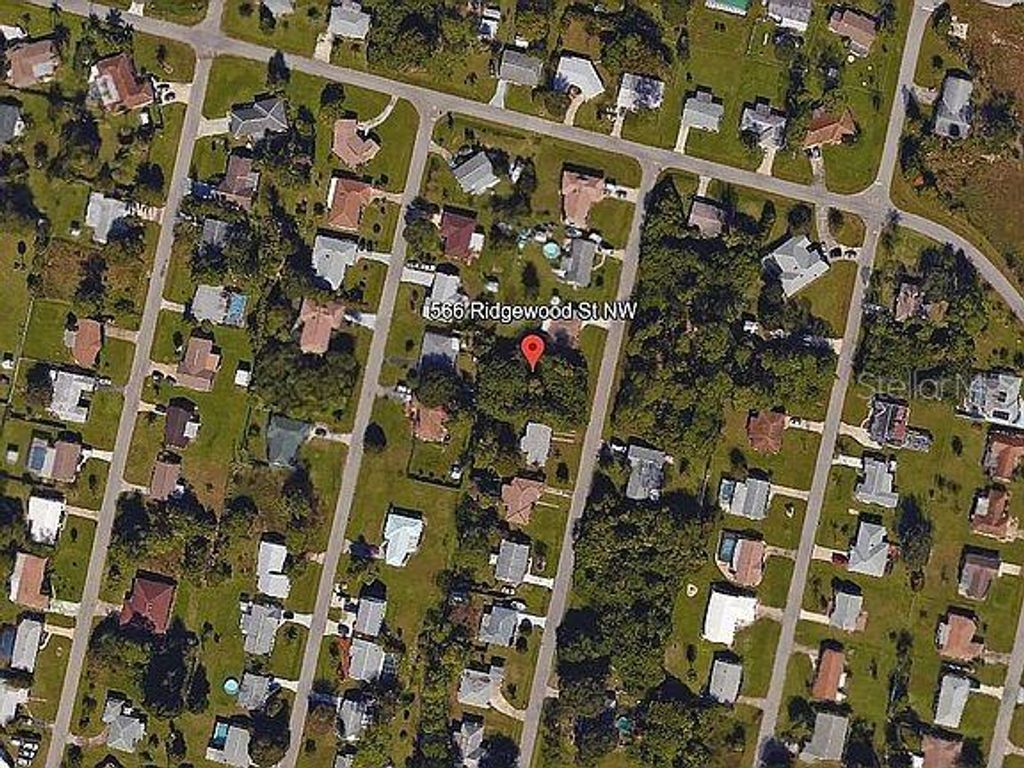 Photo of 566 Ridgewood Street NW, Port Charlotte, FL 33952 (MLS # O6371670)