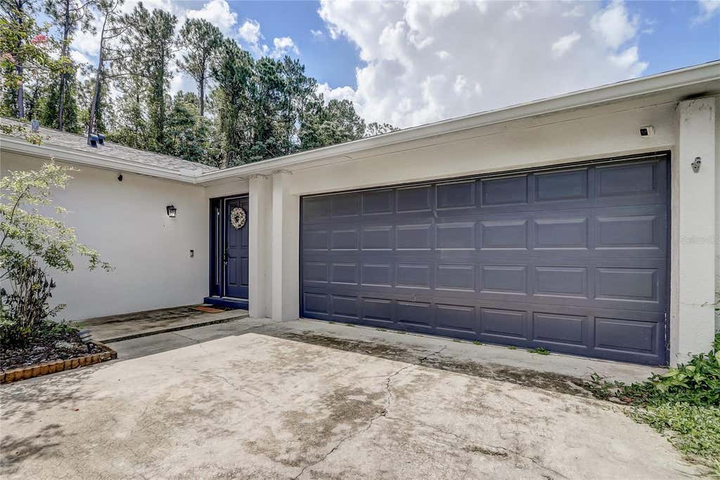 Photo of 8691 Contoura Drive, Orlando, FL 32810 (MLS # O6431970)