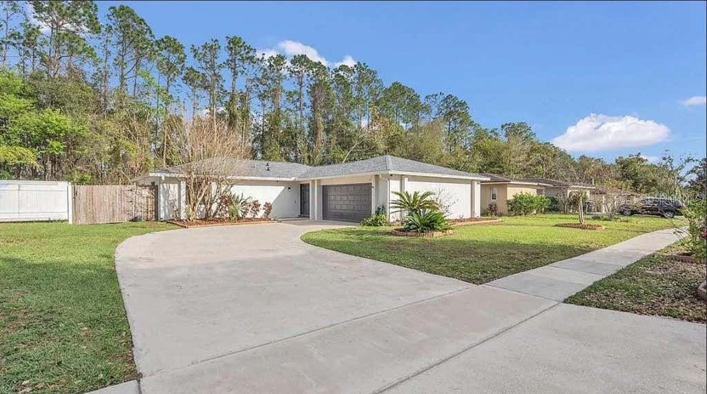 Photo of 8691 Contoura Drive, Orlando, FL 32810 (MLS # O6431970)