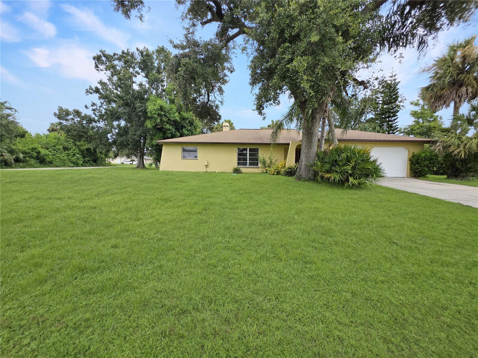 Welcome to 1205 Yorkshire Street in Port Charlotte, a spacious and inviting pool home on a rare double lot that combines comfort, character, and Florida living at its best. With four bedrooms, three full baths, and over 2,400 square feet of living space, this residence offers room for everyone while keeping a warm and welcoming feel.
Step inside to a home designed for gathering. The living room is anchored by a striking stone fireplace, vaulted ceilings, and skylights that fill the space with natural light. French doors and wide windows frame views of the pool and backyard, blending the indoors with the outdoors. A large family room opens directly to the lanai, making entertaining easy.
The kitchen features rich wood cabinetry, granite counters, a skylight, and updated appliances, flowing into the dining and living areas for a functional and inviting layout. The primary suite is a retreat with French doors opening to the pool, a spacious bath with dual sinks, walk-in shower, soaking tub, and a generous walk-in closet. Three additional bedrooms provide flexible space for family, guests, or a home office, with two more full bathrooms for convenience.
Outside, the screened lanai and sparkling pool are surrounded by plenty of deck space for lounging or dining, with mature landscaping and a fenced backyard that create both privacy and charm. The expansive double lot offers room to garden, play, or expand, while a two-car garage provides storage and practicality.
Located in a quiet neighborhood with no HOA, this home is close to shopping, dining, golf, schools, and the new Sunseeker Resort. Just a short drive brings you to Gulf beaches, boating, and fishing along Charlotte Harbor and the Gulf Islands. With its combination of space, upgrades, and location, 1205 Yorkshire is more than a home—it’s a Florida lifestyle waiting for you.