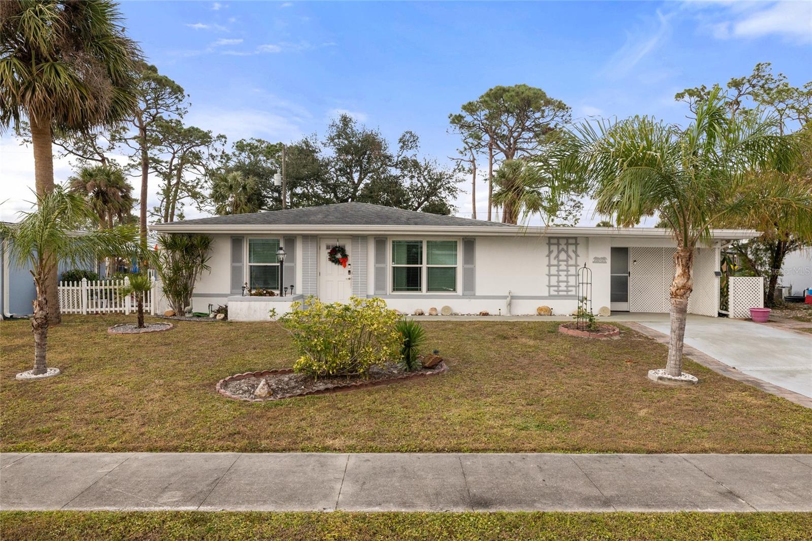 Offered for sale is this charming 2 bedroom, 1.5 bathroom home in the heart of North Port. Well maintained over the years this home features granite countertops, Hurricane IMPACT windows, a fully fenced backyard, two separate storage sheds, an enclosed patio for additional living space, efficient tankless hot water heater, newer AC, and much much more. The tile and terrazzo floor are easy to clean making this home very low maintenance and perfect as a starter home, second home, or rental property. This home is close to many great restaurants, shopping, the Atlanta Braves stadium, Warm Mineral Springs, and our beautiful beaches are a short car ride away. Don’t miss out on this opportunity, call today to schedule your personal showing today !
