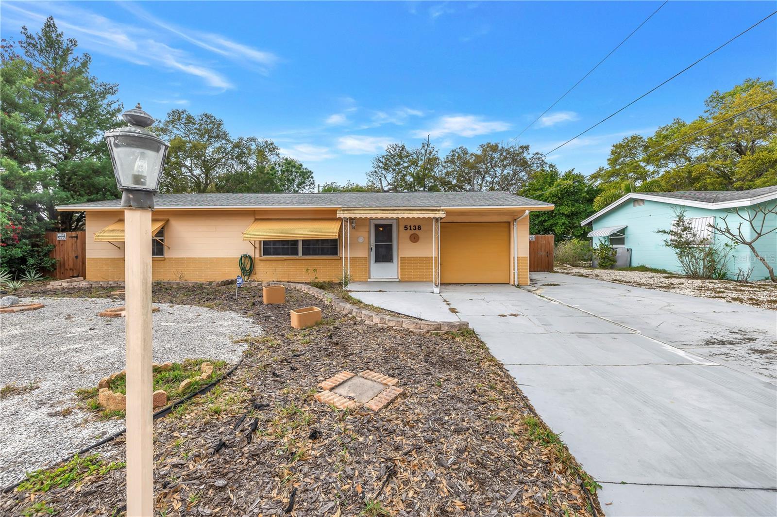 One-level ranch-style home in a quiet neighborhood located within minutes from beautiful beaches and top rated schools. With a newer roof providing peace of mind, this home is ready to welcome you. This charming residence boasts a thoughtfully designed open floor plan, providing a seamless flow from room to room. As you approach, you'll appreciate the convenience of the parking pad, offering ample space for your vehicles. Step inside to discover a spacious living area with luxury vinyl floors, creating a stylish and low-maintenance foundation for everyday living. The heart of the home is the kitchen, featuring tile countertops and floors, with plenty of counter space and storage. French doors provide easy access to the large screen porch with tile floors, seamlessly blending indoor and outdoor living. The bathroom is adorned with tile floors and a tile shower. Outside, a wood fence encloses the backyard, providing privacy for outdoor activities and gatherings. A storage shed offers additional space for storing tools, equipment, or outdoor gear. Whether you're enjoying peaceful moments on the screen porch or tending to the garden in the backyard, this ranch-style retreat offers the perfect blend of comfort and convenience. Don't miss the opportunity to make this wonderful residence your own – schedule a showing today!