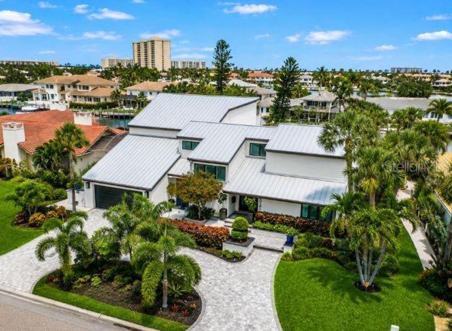 MODERN MASTERPIECE in the prestigious gated waterfront community of Bayway Isles in St. Petersburg, Florida. Extensively redesigned and enhanced throughout 2025, this extraordinary luxury waterfront residence blends timeless sophistication with contemporary elegance, creating a truly elevated living experience.
Spanning approximately 4,446 square feet, the home showcases striking contemporary architecture, expansive open living spaces, and impeccable designer finishes throughout. A dramatic two-story living room is framed by spectacular new Origin folding doors that seamlessly connect the interior to the breathtaking waterfront setting and resort-style outdoor entertaining areas. Rich wood flooring, Italian marble finishes, designer lighting, and custom details elevate every space.
Premium 2025 upgrades include all new bronze PGT impact windows and doors, custom draperies and plantation shutters, Halo whole-house water filtration system, extensive garage storage additions, and integrated smart home enhancements.
The luxurious first-floor primary suite offers a private retreat complete with fireplace, oversized custom walk-in closet, and elegant “Good Morning” coffee bar. The spa-inspired primary bath features exquisite marble finishes, soaking tub, dual vanities, and an oversized dual-head shower, creating a true resort-inspired atmosphere within the comfort of your own home.
Designed for both everyday living and entertaining, the gourmet kitchen features GE Monogram Statement appliances, a 48-inch six-burner gas range with double ovens, French-door wall oven, built-in Miele coffee station, dual refrigerators, four freezer drawers, custom cabinetry, and a stylish wet bar with wine cooler overlooking the water. The adjacent family room has been enhanced with an immersive Sonos audio system and custom motorized TV lift for an exceptional entertainment experience.
Outdoor living rivals a private waterfront resort with a marble-topped outdoor kitchen, commercial-grade hybrid gas and wood grill, expansive travertine terraces, sparkling pool, and custom waterfront bar area complete with beverage center and ice maker — all thoughtfully designed for unforgettable entertaining and relaxed waterfront living.
Boating enthusiasts will appreciate the deep-water dock with extension landing, dual lifts, and quick access to open water with no fixed bridges.
Perfectly positioned near I-275, this is one of the best commuting waterfront locations in Tampa Bay — approximately 4 minutes to the beaches, 10 minutes to Downtown St. Petersburg, and 25 minutes to Tampa International Airport.
Bayway Isles is renowned for its 24/7 guarded gate security, beautifully maintained surroundings, and exclusive waterfront lifestyle, making it one of St. Petersburg’s premier luxury gated communities.
This exceptional estate is far more than a home — it is a statement of modern luxury, craftsmanship, and waterfront living without compromise.
Furnishings may be available separately under a separate agreement.
Schedule your private showing today and experience one of St. Petersburg’s finest luxury waterfront homes.