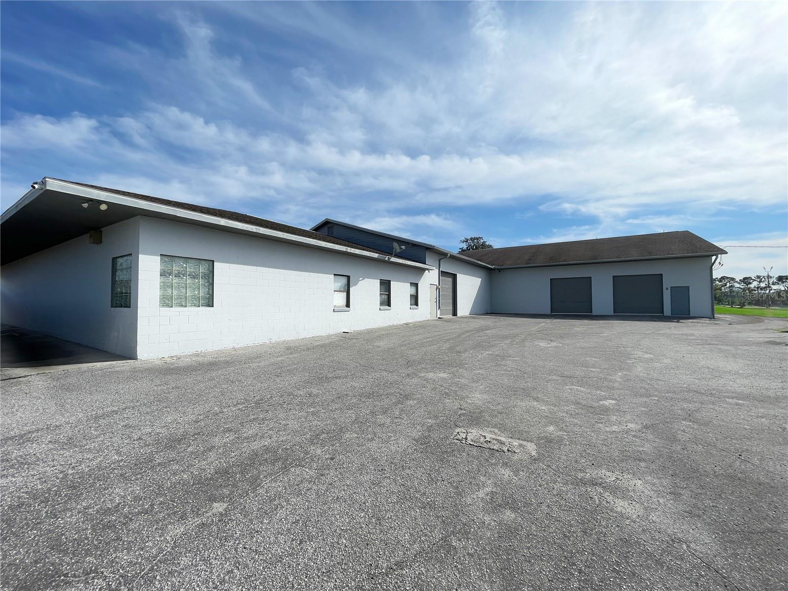 10,443 SF with M-2 Zoning on 1.18 Acres! Approximately 270’ of frontage on US HWY 441 plus corner lot (NW 58th Ave) and a great location in high growth area with expanded exposure. Block building with 3 roll up doors, 3 phase power and fenced rear yard. The Office space has 5 offices, 2 baths, reception/open area, conference room, and kitchen. NNN Leases with NNN Expenses at $2.45/SF ( Real Estate Taxes, Insurance, and Maintenance Items)