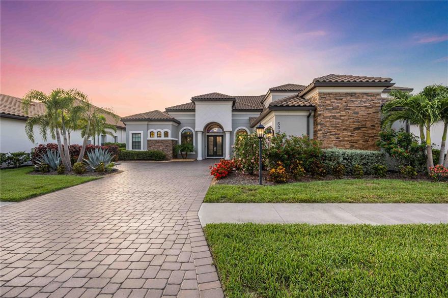 Live where luxury meets lifestyle! Welcome to your dream home—a stunning and meticulously upgraded 4-bedroom, 6 bath luxury estate that offers the perfect blend of elegance, comfort, and state-of-the-art amenities. Every detail of this residence has been thoughtfully designed for a lifestyle of sophistication and ease. The home has a whole-house water filtration system (2025) with alkaline water faucet in the kitchen that features upgraded countertops and extra cabinetry that were added to the kitchen bar. Feel the luxury with 7” custom crown molding and baseboards throughout the home. Tray ceilings with UV light and remote, and Recessed lighting throughout the home provide ambient illumination. The upgrades don't end there: enjoy a spacious bonus room, a Gas fireplace for cozy evenings, resort style window treatments with a remote control. The Gourmet Kitchen features Designer countertops and bar area with custom extra cabinets, Modern appliances and plenty of prep space. It allows a seamless access to the indoor and outdoor living areas from the kitchen perfect for entertaining guests. Enjoy luxurious outdoor living at its finest on your expansive lanai with a mini built-in kitchen, Paver lighting front and back, in the pool area, and on the pool cage. The ceiling fans with lights feature WiFi boosters in the lanai. Enjoy your panoramic “noseeum” screen over the pool area for extra comfort and additional privacy with no backyard neighbors. The pool comes with separate heaters controlled via the ScreenLogic app. The 3 car garage offers finished floors. See the feature sheet for more details in upgrades. This move-in ready estate seamlessly blends high-end finishes with smart-home upgrades and energy efficiency. Whether you’re hosting guests, enjoying peaceful evenings by the pool, or simply living your day-to-day, this home caters to every need. The community features resort-style amenities for your ultimate living experience: Club house, restaurant, fitness center, pool, just to name a few. Take your chance to live this luxurious Florida lifestyle you have always dreamed of.