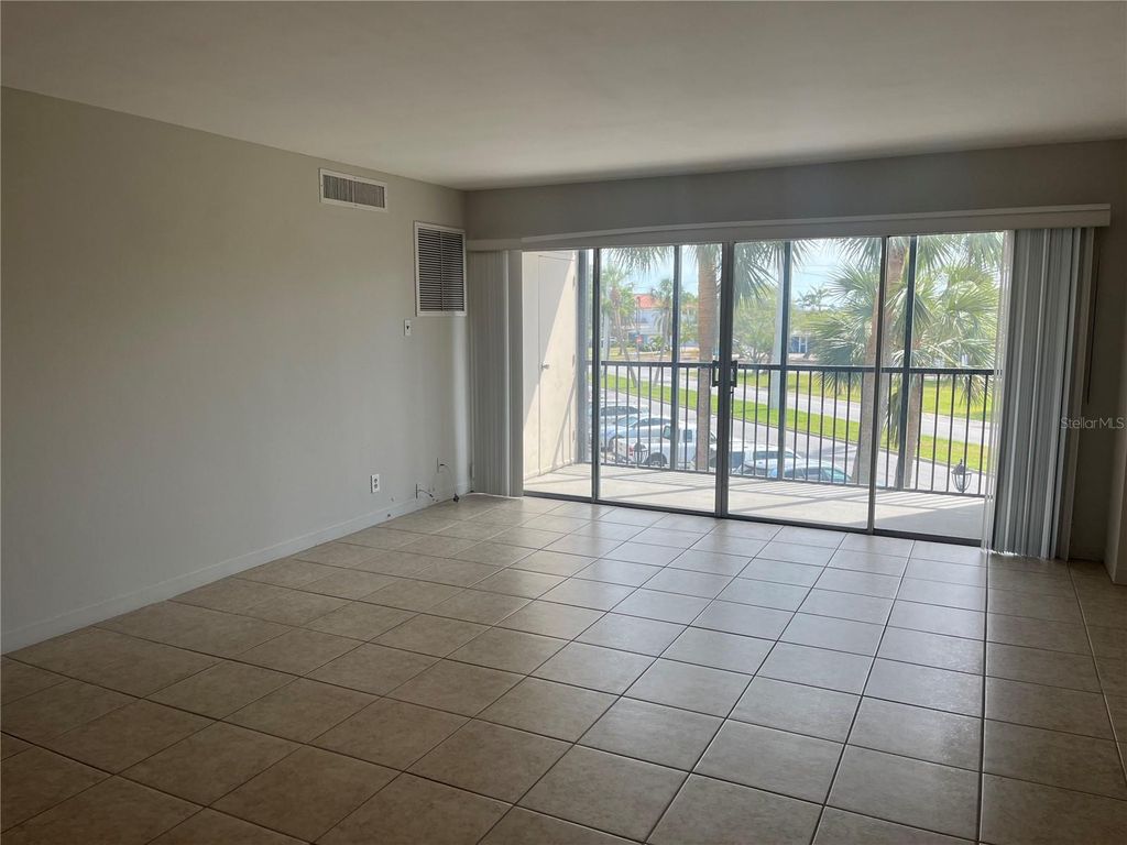 Photo of 10355 Paradise Boulevard #113, Treasure Island, FL 33706 (MLS # TB8505017)