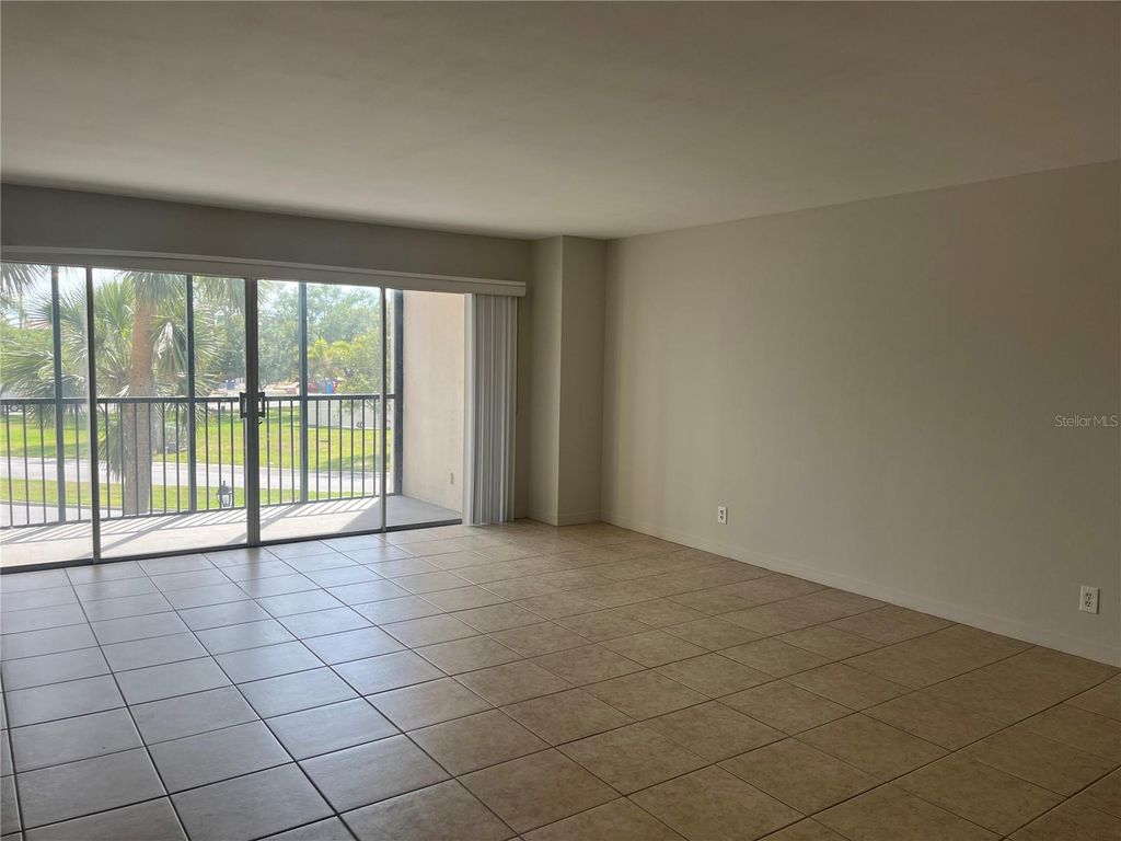 Photo of 10355 Paradise Boulevard #113, Treasure Island, FL 33706 (MLS # TB8505017)