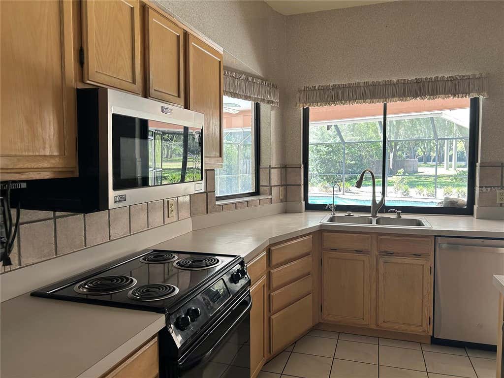 Photo of 1418 Hounds Hollow Court, Lutz, FL 33549 (MLS # TB8522613)