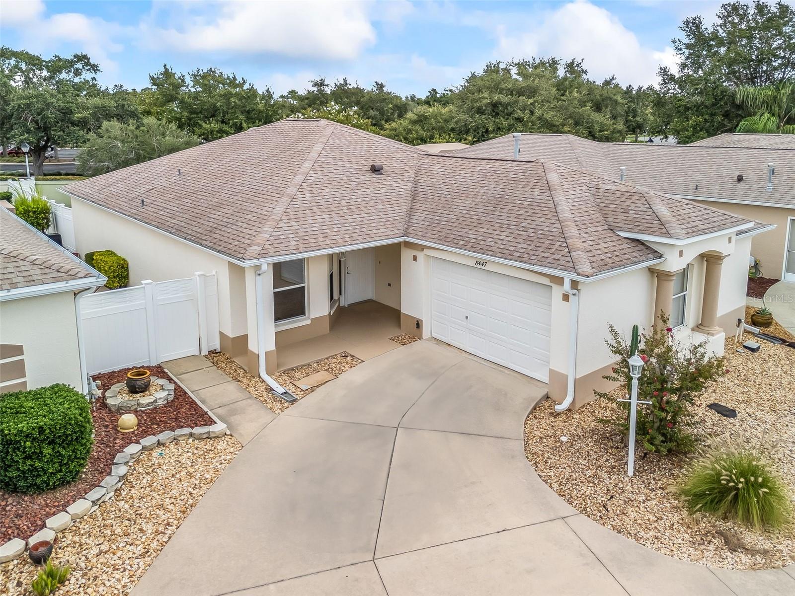 Welcome to a RARE courtyard villa with an OVERSIZED LOT in the vibrant heart of The Villages, Florida! This beautiful 3 bedroom, 2 bath home offers bright, airy living spaces with vaulted ceilings and abundant natural light that fills every room. Enjoy full sun exposure throughout the day, creating a warm and welcoming atmosphere year-round. Situated on an oversized lot, this villa features something truly special—an expansive backyard that sets it apart from most other properties in the area. THIS OVERSIZED BACKYARD HAS ENOUGH SPACE TO BUILD YOUR DREAM POOL, CREATE A CUSTOM OUTDOOR KITCHEN, ADD A COZY FIRE PIT LOUNGE AREA, OR DESIGN A SHADED PERGOLA FOR OUTDOOR DINING AND ENTERTAINING. IMAGINE HOSTING GATHERINGS, BBQS, OR SIMPLY UNWINDING UNDER THE STARS IN YOUR VERY OWN PRIVATE ENTERTAINMENT RETREAT. THE POSSIBILITIES FOR THIS SPACE ARE ENDLESS! Ideally located just outside the neighborhood is the Mulberry Grove Regional Recreation Center—one of The Villages’ premier hubs for fitness, sports, and community activities. You’re also just minutes away from shopping, dining, medical services, and many of the area’s most popular attractions. The Villages is America's top-rated active adult community, nationally known as a premier retirement destination. With more than 3,000 clubs and social groups, championship golf courses, nightly live entertainment in charming town squares, recreation centers, tennis and pickleball courts, arts and crafts, and countless other amenities, The Villages offers an unmatched lifestyle full of activity, connection, and fun. Whether you're seeking relaxation, adventure, or community, you'll find it here. Don't miss your opportunity to own this exceptional courtyard villa in one of the best locations in The Villages. Schedule your private tour today!