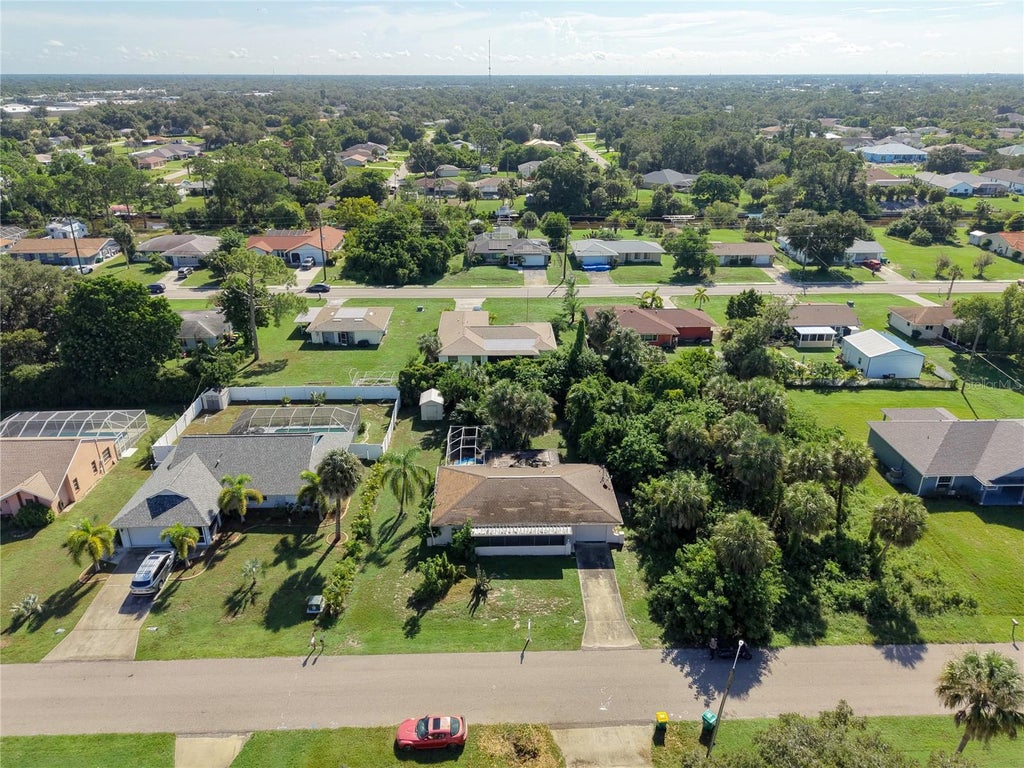 Photo of 2094 Carpetgreen Street, Port Charlotte, FL 33948 (MLS # C7530564)