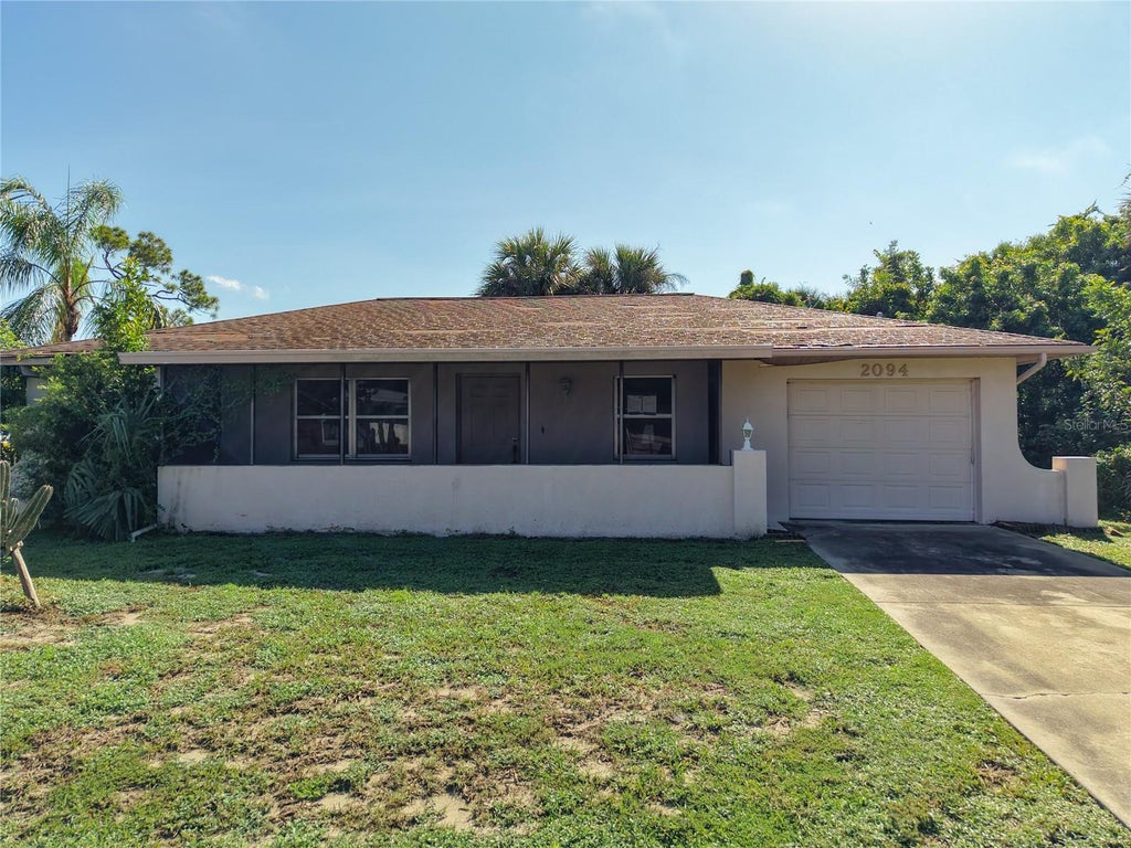 Photo of 2094 Carpetgreen Street, Port Charlotte, FL 33948 (MLS # C7530564)