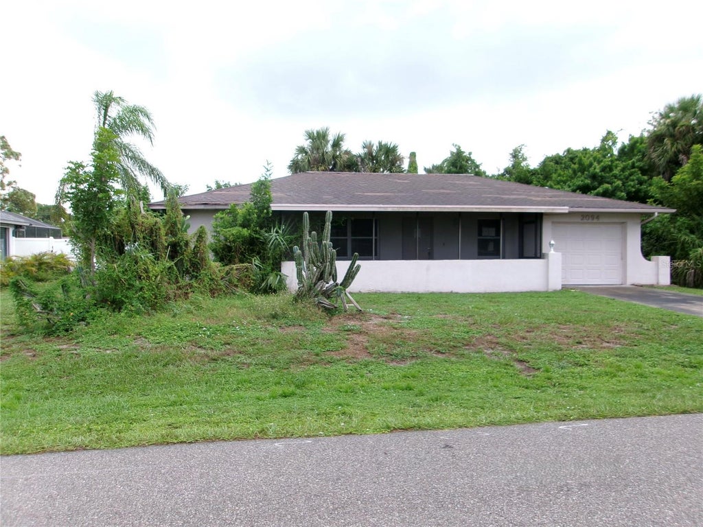 Photo of 2094 Carpetgreen Street, Port Charlotte, FL 33948 (MLS # C7530564)