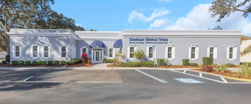This free-standing medical office in Tampa, Florida, provides a move-in-ready clinical environment situated within the high-density USF Health and Moffitt Cancer Center medical corridor. Optimized for clinical trials and multi-specialty practices, the facility offers a turnkey solution for owner-users or healthcare investors seeking a footprint in one of the Southeast's most robust medical ecosystems.

Strategic Location & Medical Ecosystem
The property is positioned for high-volume provider referrals and seamless patient access. It is located in the immediate "medical shadow" of the following major healthcare institutions:

Moffitt Cancer Center: A NCI-designated Comprehensive Cancer Center.

AdventHealth Tampa: A leading regional hospital for cardiovascular and surgical excellence.

USF Health Morsani College of Medicine: A primary hub for medical research and education.

James A. Haley Veterans’ Hospital: One of the busiest VA facilities in the nation.

Logistics: Strategic proximity to I-275 and Fletcher Avenue, ensuring regional connectivity for staff and patients commuting from St. Petersburg, Clearwater, and North Tampa.

Facility Specifications & Clinical Infrastructure
The building’s architecture prioritizes efficient patient-provider flow, minimizing bottlenecks and maximizing daily billable volume.

Specialized Clinical Assets: The interior features three wet exam rooms and a dedicated laboratory space, making it compliant for immediate clinical or diagnostic use.

Administrative & Research Suite: Includes eight multi-use offices suitable for physician consults, billing, or research coordinators, plus a professional conference room for stakeholder meetings.

Patient Experience: A bright, well-maintained waiting room and four strategically placed restrooms ensure a professional and comfortable patient environment.

Operational Support: A full kitchen/breakroom and extensive storage areas support long-shift staff comfort.

Parking & Accessibility: On-site parking for 13–18 vehicles—a critical ratio for medical zoning—ensures ease of access for a high-turnover patient base.

Investment Thesis & Future-Proofing
Turnkey Condition: Both the interior and exterior have been meticulously maintained, offering immediate occupancy with zero deferred maintenance—a significant advantage in a high-interest-rate environment.

Adaptive Reuse & Multi-Tenancy: While currently optimized for a single high-performance tenant, the dual-entry potential and internal layout allow for easy multi-tenant conversion. This provides investors with a "de-risked" asset that can pivot based on market demand.

Asset Class Performance: Healthcare Real Estate (Medical Office Buildings/MOBs) continues to outperform standard commercial office space due to the "stickiness" of clinical tenants and the aging demographic in the Tampa Bay region.
