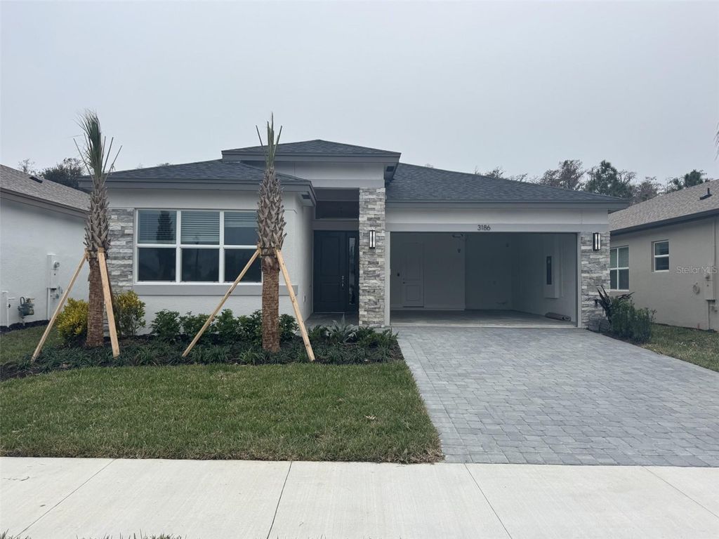 Photo of 3186 Malta Avenue, Wesley Chapel, FL 33543 (MLS # J996147)
