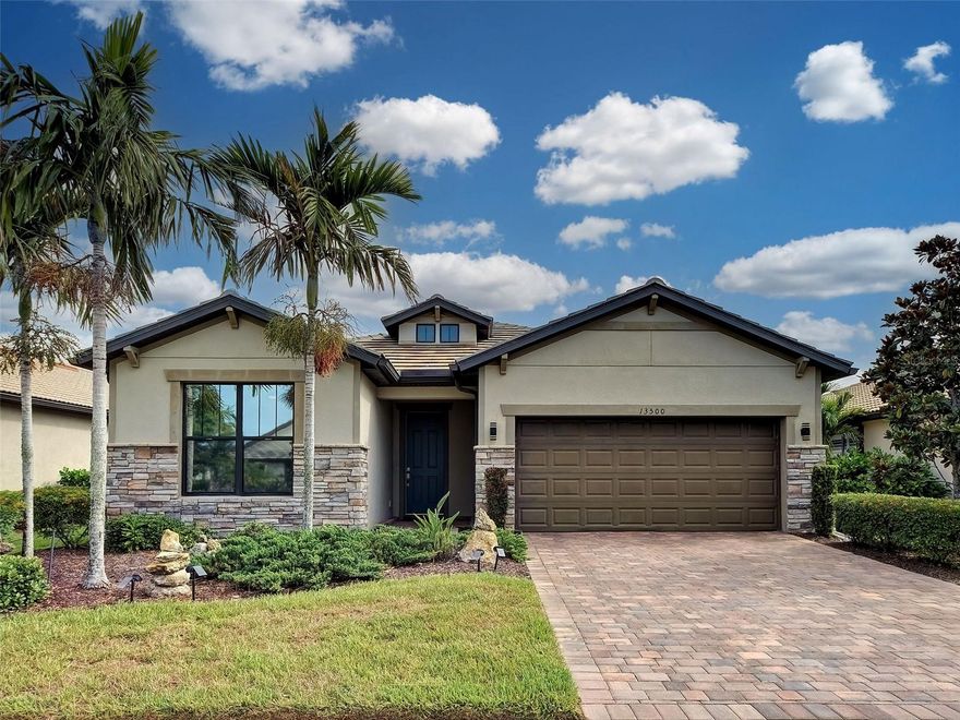 Under contract-accepting backup offers. This beautifully maintained ABBEYVILLE is located in the highly desirable, active community of IslandWalk in Venice. This thoughtfully designed home offers 2 bedrooms, 2 bathrooms, a FLEX ROOM, and an additional SUNROOM, giving you flexible options for living, dining, working, or relaxing. Outside, the DEEP LOT provides plenty of space to add a pool if desired, while still maintaining privacy and a peaceful outdoor setting with STUNNING CONTINUOUS WATER VIEWS!
The layout feels open and comfortable, with smart use of space. TILE flooring runs throughout the entire home—NO CARPET—paired with neutral tones, a WATER SOFTENER, and ADJUSTABLE BLINDS on EVERY WINDOW. The kitchen features abundant white cabinetry with PULL-OUT DRAWERS, a gorgeous backsplash, added lighting, and an UPGRADED 3-YEAR-OLD BRAVO STOVE that has never been used! The dishwasher has also never been used! Adjacent to the kitchen is the bright sunroom, currently used as a dining area, complete with TINTED SLIDER DOORS that bring in natural light while maintaining privacy. The original dining room is being used as an extension of the great room, creating a larger, more open living space that feels spacious and comfortable. The primary bedroom offers peaceful WATER VIEWS, a generous walk-in closet, and an ensuite bathroom with a WALK-IN SHOWER WITH GLASS DOOR, dual sinks, and a grab bar. The flex room includes French doors and a ceiling fan, making it ideal as an office, hobby room, or occasional third bedroom. The guest bedroom is located at the front of the home and includes a built-in closet with easy access to the guest bathroom. A true highlight of this home is the WALK-IN STORAGE ROOM located inside the laundry area, complete with upgraded Samsung washer and dryer—an excellent feature for organization and convenience. Step outside to the covered and screened lanai overlooking the water.  Storm shutters are included for added peace of mind during storm season. The SUPER CLEAN 2-CAR GARAGE features an insulated door and epoxy flooring. The upgraded elevation includes a STONE ACCENT FRONT, paired with well-maintained landscaping that enhances the curb appeal and gives the home a warm, welcoming presence from the moment you arrive. This home is ideally located between both amenity centers! Living in IslandWalk truly feels like being on vacation all year long. The community is known for its active, social atmosphere and an impressive lineup of amenities. Residents enjoy geothermal resort and lap pools, Har-Tru tennis courts, pickleball and bocce courts, a spa, playground, basketball court, dog park, and two fully equipped fitness centers. There’s also a 24-hour staffed gate, on-site HOA team available seven days a week, outdoor gathering spaces with firepits and BBQ grills, a library, and plenty of activities to keep everyone entertained. Golf carts are welcome throughout the neighborhood, and registered carts can even be taken outside the community. The HOA fee includes cable, internet, and full ground maintenance, adding convenience and value for residents. A resident-only back gate provides quick access to downtown Wellen Park, where you’ll find restaurants, shops, live entertainment, a weekly Farmer’s Market, and the Atlanta Braves’ spring training stadium. IslandWalk is also in a prime location—just 4 miles from I-75, making it easy to reach several beautiful Gulf beaches, four major airports, historic Venice Island, and so much more.
