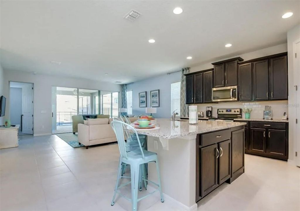 Photo of 9031 Pelican Cove Trace, Kissimmee, FL 34747 (MLS # O6359207)