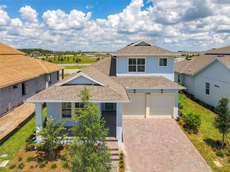 Move-In Ready Luxury Residence in Laureate Park
This well-maintained, designer home lies in a prime Laureate Park location, offering modern style and practical living. With 6 bedrooms and 5 bathrooms , it provides space and comfort close to top employers like VA Medical Center, Nemours Children's Hospital, KPMG, and USTA.
Features include an open floor plan, bright living spaces, large bedrooms, a pet-friendly design, and a kitchen with plenty of storage and work surfaces. The property is near Lake Nona Town Center, the airport, and Highway 417 for easy access.
The gourmet kitchen comes with high-end stainless steel appliances, a built-in wall oven and microwave, solid wood cabinets, and a bold blue island centerpiece.