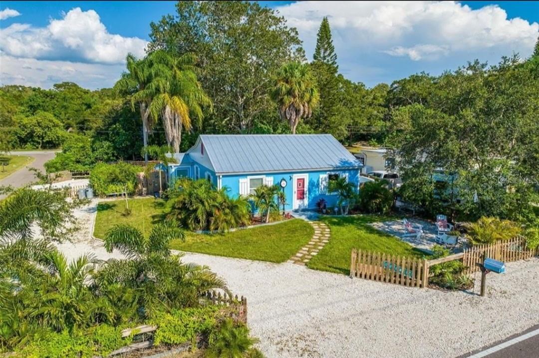 Unique single-family property currently configured as two separate units — a studio and a 2BR/1BA — each with its own entrance and fully fenced private yard. Operated as a successful short-term rental with bookings in place for season. Located in unincorporated Pinellas County where STRs are allowed (buyer to verify), just 2 minutes to Downtown Dunedin, a few blocks to the Pinellas Trail, and near a neighborhood dog park. NON FLOOD ZONE, NEVER FLOODED.
A third large fenced yard on the side offers exceptional flexibility — potential site for an ADU, RV/boat/car storage, or continued secure storage. Large driveway for ample parking.
Live in one unit and rent the other to offset the mortgage, host family with privacy, or easily convert back to one unified home later if desired. The layout and multiple yards offer privacy and versatility rarely found this close to Clearwater and Dunedin.