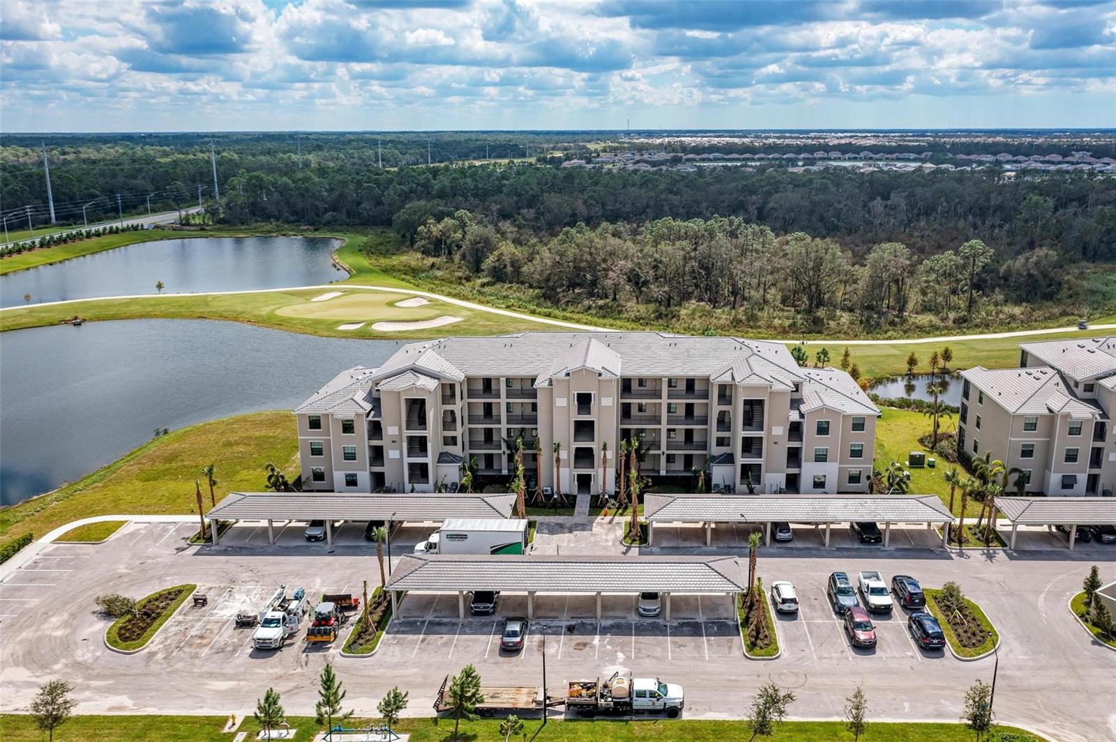 Prepare to be AMAZED by This Jaw-Dropping 4th Floor Condo Overlooking the Breathtaking Lakewood National Golf Course!
Get ready to dive headfirst into an extraordinary journey of luxury, serenity, and endless fun! Welcome to your dream home in the absolutely stunning Lakewood National community, where every day is an adventure, and your cares will simply melt away! This spectacular 2-bedroom, 2-bath condo invites you to indulge in a living experience so opulent, you'll feel like royalty! As you swing open the front door, BOOM! – you're greeted by the most incredible view of the golf course and lake that will literally take your breath away! The open-con living room, dining room, and show-stopping kitchen are bathed in natural light, creating the perfect space to entertain and soak in those mind-blowing vistas. Whip up a gourmet meal in your chef-inspired kitchen, complete with gleaming stone countertops, an enviable island with a breakfast bar, and top-of-the-line stainless-steel appliances that will make your inner foodie swoon! Retreat to your master sanctuary, featuring a plush king-size bed, two enormous walk-in closets, and a positively divine spa-like ensuite bathroom that rivals any 5-star resort. Your guests will rave about their stay in the cozy queen-size bed and convenient access to the second beautifully appointed bathroom, or transform the space into your ideal home office – the possibilities are endless! But hold onto your hat, because Lakewood National offers a mind-boggling array of world-class amenities that will cater to your every desire! Dive into the crystal-clear waters of the resort-style pools, work up a sweat in the cuttingedge fitness center, or treat yourself to some serious R&R in the full-service spa. And the pièce de résistance? A championship 36-hole golf course right in your own backyard – it's time to perfect that swing! Situated in the most enviable location, you'll be mere moments away from the finest dining, entertainment, and shopping destinations around. Picture this: every day is a new adventure, and your dream life is finally within reach! So, are you ready to seize this once-in-a-lifetime opportunity and embrace the luxury, leisure, and limitless possibilities that await you at Lakewood National? Don't let this incredible condo slip through your fingers – contact us RIGHT NOW to schedule your exclusive VIP showing, and prepare to be blown away by the most extraordinary living experience you've ever encountered! Your dream home is ready and waiting, and your new life starts today!