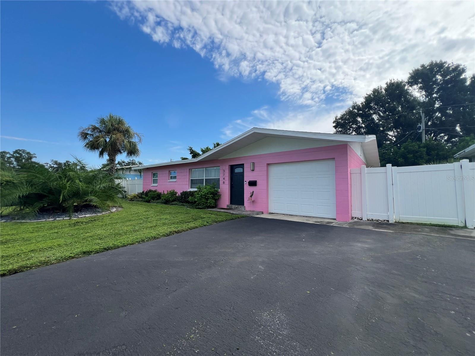 Experience the ease of island living in this private retreat just minutes from downtown St. Petersburg. Enjoy a walkable lifestyle unique to this special island community. Stroll to coffee shops, two highly rated restaurants, and a welcoming neighborhood pub, or spend time at Coquina Key Park with its basketball, tennis, pickleball, soccer fields, two dog parks, waterfront jogging trail, family movie nights, and a festive Christmas parade each year. This fully furnished, thoughtfully updated 2-bedroom, 1-bath home offers comfort and style, featuring a garage with built-in shelving, a cozy fireplace, designer lighting, and a fully fenced yard ideal for entertaining. Sliding glass doors lead to a covered screen porch, the perfect spot to sip morning coffee or unwind in the evening breeze. With downtown’s galleries, shops, and museums only minutes away—and world-class beaches just a short drive—this location offers both tranquility and access to the best of St. Petersburg. The landlord may consider a shorter-term lease or renting the home unfurnished, making it a flexible option for those seeking the true island lifestyle.