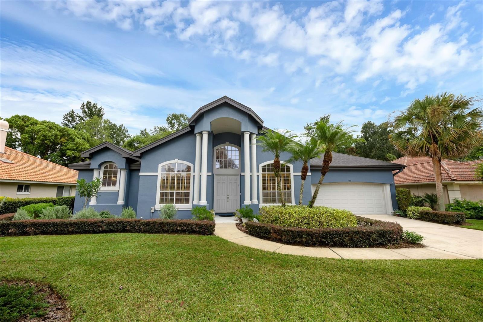Welcome to 493 Winding Creek Place in Sabal Point's Sabal Creek! — Tucked into the curve of a quiet cul-de-sac, 493 Winding Creek Place is the kind of place where life spills effortlessly from indoors to out. This home packs a lot in - offering the best of Sabal Point/Wekiva Springs living. This beautifully updated home offers a two-car garage, a recently resurfaced pool, and thoughtful upgrades throughout. Step inside to an open, airy layout filled with natural light. Whimsical, high-end statement light fixtures—yours to keep—add character in every room. To one side of the foyer, a formal dining room awaits; to the other, a versatile flex space perfect for a playroom, home office, or workout area. The living room is anchored by soaring cathedral ceilings and a fireplace with custom built-ins for both storage and display. The kitchen is spacious, with an eating nook, abundant cabinetry, double ovens, stainless steel appliances, and even a butler’s pantry to keep the chaos tucked away. French doors and a wall of windows connect the living space to the screened pool area, creating a seamless flow for entertaining. The primary suite is generously sized, with room for a king bed, sitting area, and more. The updated en suite bath features a walk-in shower, soaking tub, water closet, and a double vanity with a crisp white finish, plus a huge walk-in closet. Three additional bedrooms include a Jack-and-Jill setup, while the fourth can serve as another flex space if needed. The laundry room is oversized, complete with washer, dryer, utility sink, and shelving for extra storage. Outside, enjoy a large lanai, outdoor sink, updated pavers, a newer pool cage, and a beautifully landscaped yard with native Florida plantings, a garden path - picture ALL of this against the private backdrop of conservation (behind this home, Sabal Creek winds its way out to the Little Wekiva River). This home blends comfort, style, and nature in one of Longwood’s most desirable neighborhoods—close to top-rated schools and all of the best that Seminole County living has to offer!