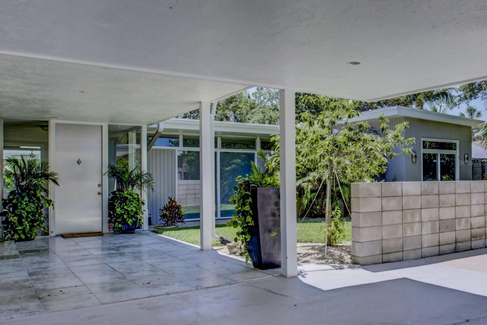 You will Never Want to Leave this 4-bedroom house on Siesta Key! Mid-Century Modern, 4 bedroom home with saltwater, heated Pool with canal views. Located within a 6 minute bike ride to Siesta Key's Beach Access #5 and walking distance to everything that Siesta Key Village has to offer. This unique 1950's built, partially renovated, 4 bedroom, 3 full bath, "Sarasota School of Architecture style" pool home brings a blend of both vintage and urban accents, make this home TRULY unique and one of a kind! From the stainless steel front door & glass foyer, to walls of glass for incredible views. Fully furnished price is $8400, unfurnished $7400. Lawn and pool care included.
Cook gourmet meals in this spacious, beautifully updated kitchen with a skylight allowing natural light to shine in, built in double ovens, glass cook top range, solid slate countertops. The kitchen dining area includes incredible water views!
Open the multiple sets of sliding glass doors to the covered lanai and pool deck. The luscious, mature landscaping surrounding this property, add to the feel of a tropical, one of a kind, getaway.
The spacious master bedroom suite with king sized bed features multiple sliding glass doors leading out to the pool and deck with walls of glass for incredible views of water, a large sitting area plus original built-ins and an en-suite modern, upscale bath with walk-in tiled shower. The second bedroom has a queen bed, closet, and includes a door leading out to front patio area.
The third and fourth bedrooms have queen beds, with closets and lots of natural light. One opens up to the front and one has its own on-suite bath and separate seating area leading to the back pool and canal. This area can be completely closed off for as a private suite.
There is a big, circular drive for parking and a shed for additional storage space with sufficient space to store your bicycles for riding into town and to the beach. Stacked washer and dryer off the kitchen for your convenience.
6500 LB boat lift for boat up to 23', only 1 bridge to bay (Grand Canal bridge).