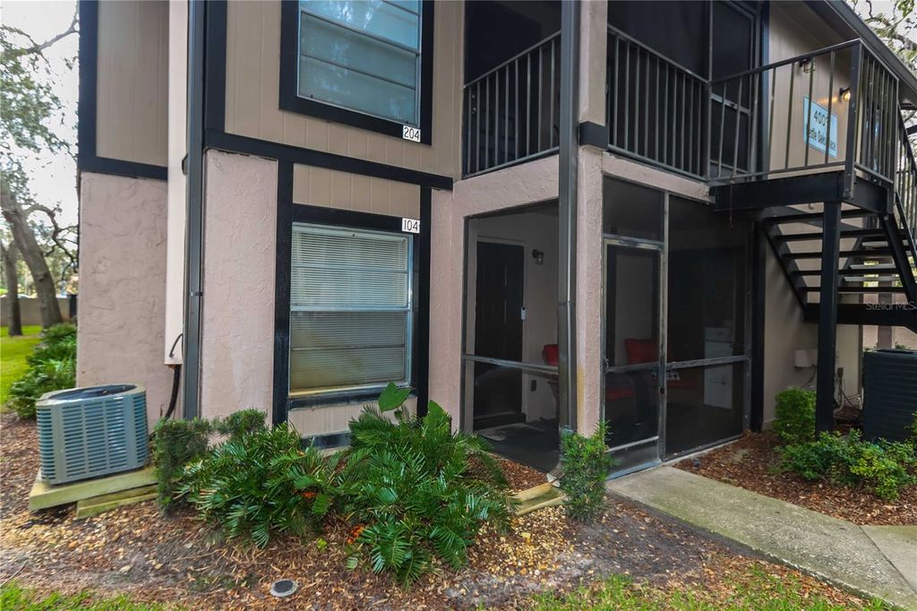 Photo of 4009 Nestle Oaks Place #104, Tampa, FL 33613 (MLS # TB8463784)