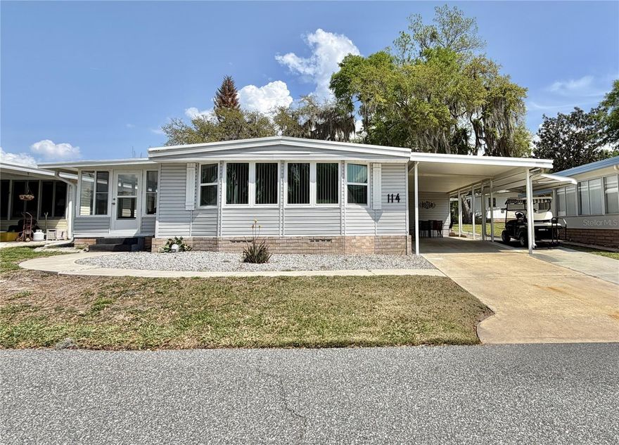 Must see fully furnished turn-key home where comfort and livability blend with understated appeal. This inviting two-bedroom, two-bath residence offers 1,332 square feet of well-proportioned living space, creating a welcoming retreat from the moment you arrive. A generous driveway with a dedicated golf cart pad, along with an included golf cart and barbecue grill, enhances the home’s easygoing, ready-to-enjoy lifestyle. The exterior showcases low-maintenance vinyl siding, while inside, upgraded living room windows invite in soft, natural light, complementing the freshly refreshed interior palette. A Florida room under heat and air extends the living space, offering a versatile setting for relaxation or casual gatherings throughout the year. The kitchen is efficiently arranged and fully equipped, while well-kept carpeting carries throughout, adding a sense of comfort underfoot. The primary suite features a spacious walk-in closet and a newly updated walk-in shower in the en-suite bath, while the guest bath includes a tub for added convenience. Thoughtful upkeep is evident in the home’s major components, including a 2018 HVAC system, 2004 water heater, 2025 washer and dryer, and a carefully maintained roof. With its blend of functionality, warmth, and move-in-ready ease, this residence presents a seamless transition into your next chapter.................Hawthorne at Leesburg is an active, resident owned, 55+ cooperative, waterfront, gated community, with beautifully landscaped grounds, lakes with illuminated fountains and a relaxing and comfortable gazebo. The affordable monthly maintenance fee of $397 includes water, sewer, lawn mowing, private emergency services and storage space for recreational vehicles, boats, trailers and much more! The beautiful clubhouse is complete with a full-time program coordinator, more than 100 different activities and seating for 550. It has a hospitality lounge, card rooms, craft rooms, billiard room, fitness center, library, fine arts room and many more. There is excellent fishing, outdoor geo-thermally heated pool and two enclosed therapeutic pools. Hawthorne boasts a private marina monitored by an electronic security system with over 120 boat slips and access to the Harris Chain of Lakes and beyond.