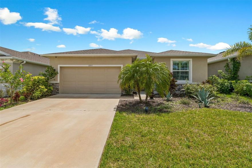 Step into comfort and style with this beautiful 4-bedroom, 2.5-bath all-concrete-block-constructed home in the sought-after Bella Lago community. Built in 2022, this home offers 2,043 square feet of easy living space designed for everyday enjoyment and entertaining. The bright and open floor plan features updated luxury vinyl plank flooring, added plantation shutters, and a gorgeous kitchen with all-white cabinets and granite countertops—a perfect place to gather with family and friends. A whole-house water filtration system and whole-home surge protection add extra peace of mind and convenience, while the screened lanai invites you to relax and take in peaceful views of the preserve, where nature is right in your backyard. The primary suite is a true retreat with a tray ceiling, his-and-hers walk-in closets, and a spacious ensuite bathroom complete with dual sinks, an extra-large vanity, garden tub, separate shower, and private water closet. The garage has been updated with epoxy floors and two hanging storage racks as well. Residents of Bella Lago enjoy access to two resort-style pools, a fitness center, a playground, and a dog park. Come see why this home is truly turnkey and the perfect place to start your next chapter!