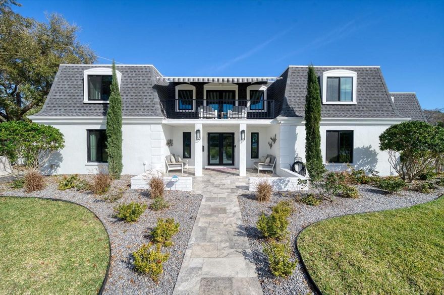 Come see this home’s recent elegant transformation into a thoughtfully-designed beautiful spacious retreat!  It's 3,830 heated square feet with 5 bedrooms and 5 baths (two half baths; one inside & one outside) offer both privacy and convenience as well as ample space for entertaining. Also, the two 2-car garages, one attached and one detached with a partially finished apartment,  adds versatility and potential for various uses. 
Pull up to the curb and admire this homes aesthetic style, exhibiting its old-world charm both inside and out with modern conveniences and functionality. The completely new and thoughtfully designed kitchen and dining rooms stand out as the focal points of this home, and the addition of a 700+ bottle wall wine cellar and gas fireplace adds a touch of sophistication and elegance.  You will enjoy gorgeous modern features and high-end finishes that have elevated the property, creating a residence that not only boasts fashionable design but also incorporates practical elements for a comfortable and luxurious lifestyle. Up the stairs and out onto the balcony, a retractable awning provides shade and comfort creating a relaxing haven to appreciate the natural beauty and stunning sunsets that surrounds the home.  The composite dock with a 13,000 lb lift operated by a remote adds a touch of convenience for boating enthusiasts. Moreover, the 50’x26’ wet slip, spacious enough to accommodate a catamaran, offers versatility for various boating preferences.  
Now enter the large owner's retreat - a splendid haven that creates a serene and peaceful atmosphere to relax and enjoy within your own home.  The bathroom is a true oasis, featuring a spacious shower and soaking tub, offering a relaxing escape for moments of tranquility. 
Adjacent to the master bath, the previous 6th bedroom has been transformed into a large owner’s closet, complete with California Closet built ins. This thoughtful conversion enhances the functionality of the space, creating a dream closet perfect for organizing and displaying your clothing collection. 
Heading outside the back sliding doors reveals a spacious backyard designed for both relaxation and family fun, featuring an inviting heated pool and spa; a pool bath ensures convenience and accessibility. The outdoor kitchen with an overhead pivoting Pergola adds a culinary element to the yard, making it an ideal place for al fresco dining and entertaining guests. 
All this and so much more to love, this property boasts a perfect blend of luxury, functionality, and modern amenities, and is located just 3 minutes to Treasure Island, 10 minutes to downtown St Pete, and 25 minutes to Tampa Int'l Airport.  Owner's suite chandelier does not convey. A complete and detailed list of updates done in the renovation is available for the asking! Family room is currently being used as a dining room.  All measurements approximate and should be verified. Bedroom Closet Type: Walk-in Closet (Primary Bedroom).