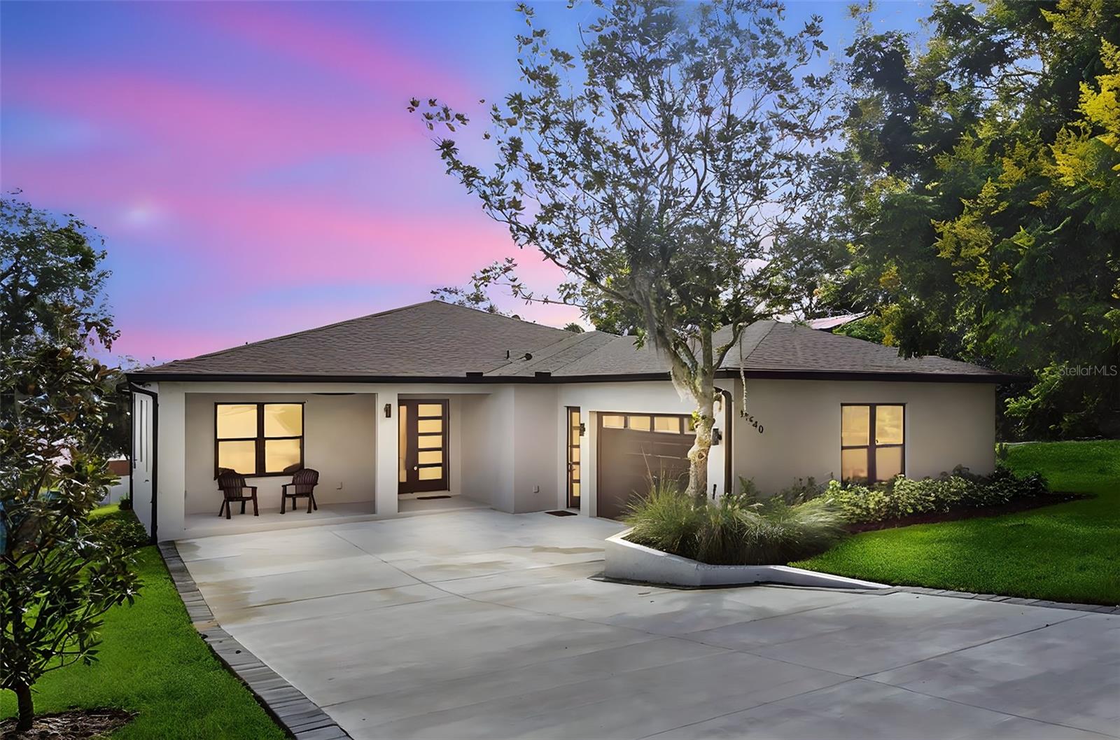 Welcome to this beautiful brand new custom built home! From the inviting front porch, step into the welcoming foyer that opens to an impressive open concept living area, ideal for everyday living and entertaining. the large custom kitchen is a chefs dream, featuring granite countertops, luxury vinyl flooring and ample cabinet space. This home offers four bedrooms and three full bathrooms. Relax in the beautiful primary bedroom with beautiful lake views, a luxurious bathroom featuring a soaking tub, walk in shower, and a walk in closet. Separate inside laundry room with stainless Steele sink and granite counter top. Enjoy Florida living from the screened in back porch, the perfect spot to take in the amazing views of Lake Apopka. Additional highlights include an oversized two car garage. This home is a block home with spray foam insulation in the block walls for energy efficiency.This custom home truly has it all, thoughtful details and serene lake views. Live in the quaint town of Montverde but close to great restaurants, shopping and the turnpike. DONT MISS THE OPPORTUNITY TO MAKE IT YOURS!!!!