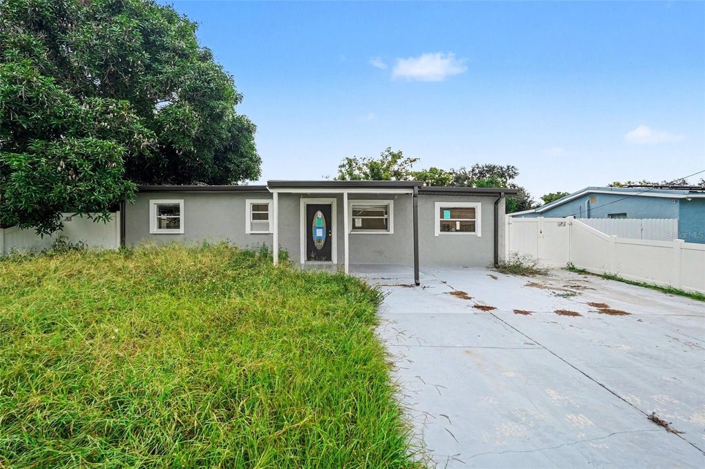 Photo of 10925 N Florence Avenue, Tampa, FL 33612 (MLS # TB8555627)