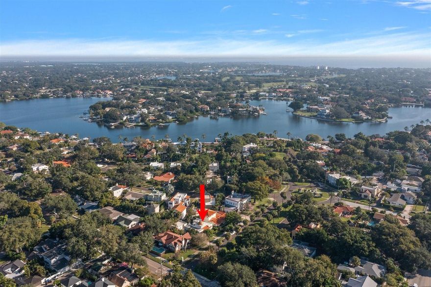 Scenic Old-World elegance and culture surrounds as you enter (The Granada Terrace Historic District) of The Old Northeast. A vision of Perry Snell as he developed along the beautiful waterfront of St. Petersburg, FL. This Granada neighborhood was designed in the true Mediterranean Spanish Style of Granada, Spain. The scenic views of the wide boulevard with bougainvillea covered trellis', the brick streets with granite curbs, the water view of Coffee Pot Bayou invites one to slow down and enjoy.  

Welcome to this one-of-a-kind home custom built by Perry Snell (known by the locals as the “Golden Dome House”). The unique architectural elements such as the dome, the front arches with wrought iron embellishments are visible before stepping into the covered front porch. As the beauty unfolds from the original tile floor to the double French doors you are invited to enter the living room with a tall, beamed ceiling, original wood floors, a large fireplace with decorative details and French doors that open to the expansive verandah.

The eat-in Kitchen with hardwood floors, an oversized island, beautiful wood cabinets, soft-close drawers, blue granite counters, double sink, built in microwave drawer, GE Café gas range, and vented stainless steel exhaust. The formal dining room with windows and wood floors is open to the living room and kitchen.

Two bedrooms are located on opposite sides of floor plan away from entertaining areas. Both have original wood floors and large double door closets. The front one has a French door leading to front porch and two double French doors opening to the front garden. The split a/c system creates individual sleeping temperature. The full bath is updated and bright.

The sparkling half- bath has been redone near the laundry area. The office is at the back entrance. Newer windows and French doors allow natural light throughout this home. 

As you step out from the kitchen you will encounter the spacious and private courtyard characteristic of Granada’s architecture. It leads to the in-law suite that has a private locked entrance, a full bath with walk in shower, instant water heater, zoned cooling and heating and a spacious closet with mirrors. From the courtyard you can enjoy the rear yard offering a garden of herbs and flowers growing side by side along with citrus, lychee, avocado and mango trees. The patio located in front of the in-law suite is a perfect spot to sit and enjoy the fruits of nature. 

There are many more features in this home for you to see.  Original glass doorknobs and brass features have been cleaned and polished.
 
In the garage is a worktable, built in storage cabinets, a cleanup sink and automatic door opener.

This home has been lovingly cared for through the years. This Historic neighborhood is unique and will remain so for years to come. Conveniently located two blocks from Coffee Pot Bayou and the waterfront parks system; close to downtown St. Petersburg, the many museums, the waterfront restaurants, and shopping.