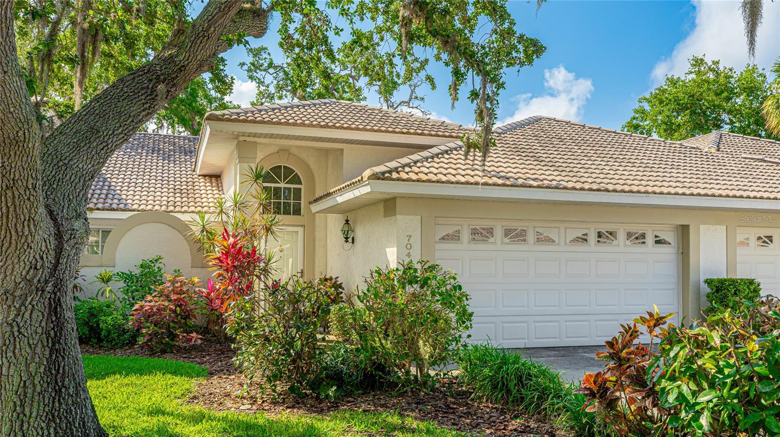 This home is in an outstanding location in the very private neighborhood of Woodside Oaks that has only 17 homes total with a great pool and undercover outdoor seating area just steps away. The home features a great room with vaulted ceilings and skylights in kitchen and family room creating excellent bright natural light . The open layout allows for a clear view of the lush backyard setting from any of the living area rooms. There is slider access from the family room and slider access from the owners suite to the covered lanai. The split-bedroom floor plan provides privacy for both owners and guests. The owners suite has a large walk-in closet and a bathroom with dual sink vanity and walk-in shower. Enjoy maintenance-free living with roof and exterior maintenance included in the HOA. Ideally situated just off Tamiami Trail (route 41) so you will have quick access to our many beaches including Siesta Key and the unique shopping and dining there and very close access to Gulf Gate’s vibrant and eclectic shopping and dining. Many additional shopping and entertainment locations are close with east access on Tamiami Trail to downtown Sarasota and Osprey, Nokomis and Venice.