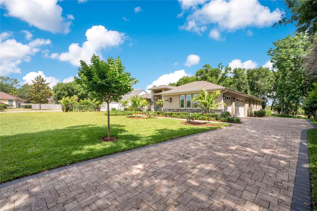 Photo of 1107 Palm Cove Drive, Orlando, FL 32835 (MLS # O6406584)