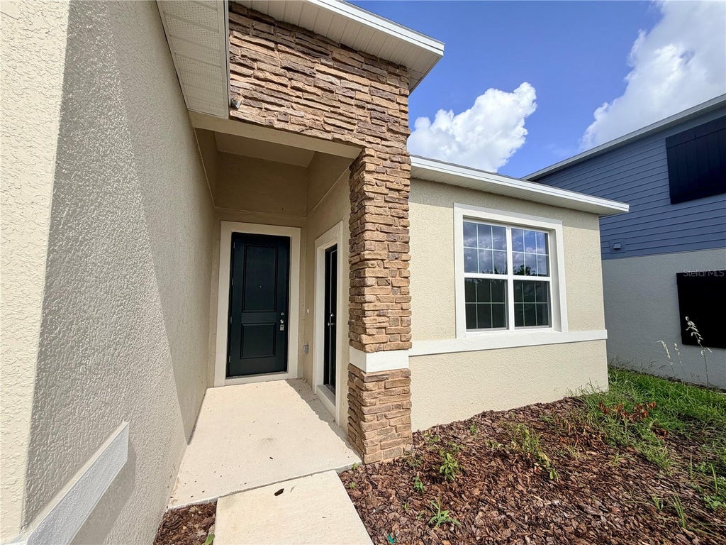 Photo of 5177 Green Belt Drive #UNIT A, Haines City, FL 33844 (MLS # O6419078)