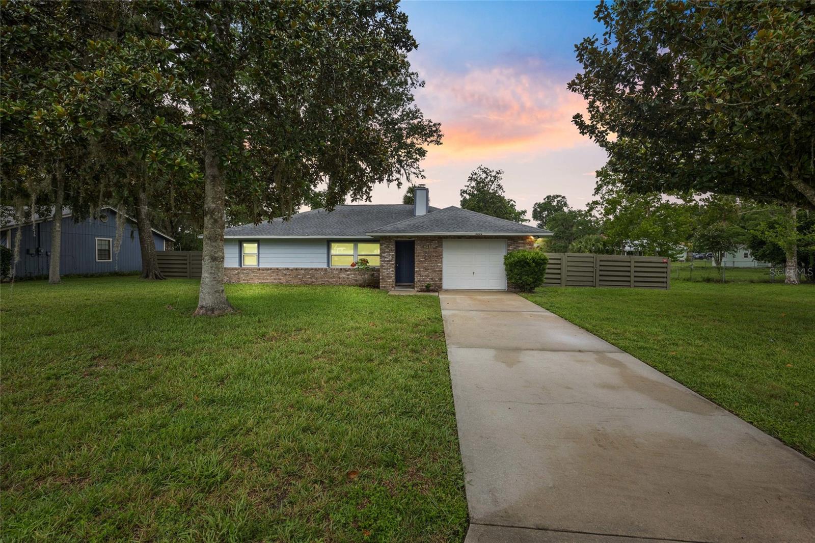 Beautifully updated and move-in ready, this 3 bedroom, 2 bathroom home is located in the desirable South Oak neighborhood in SE Ocala. Inside, you’ll love the spacious and functional layout featuring a large living area with a cozy wood-burning fireplace, perfect for relaxing or entertaining. The split-bedroom floor plan offers privacy, with the primary suite featuring a walk-in closet and a fully updated ensuite bath.
Recent updates provide peace of mind and modern comfort: new roof and windows (2022), ceramic tile flooring throughout (2022), renovated kitchen and bathrooms (2023), new stainless steel kitchen appliances (2023), soft-close cabinets and drawers in the kitchen, new A/C (2023), and new water heater (2023). Laundry area is located in the garage and features a utility sink along with a new washer and dryer (2023).
Step outside to a spacious, private backyard with a brand new fence (2024)—perfect for pets, play, or outdoor gatherings. Located just minutes from shopping, dining, and schools, this well-maintained home offers both style and convenience in a quiet, established community. Don’t miss your chance to see this one in person!