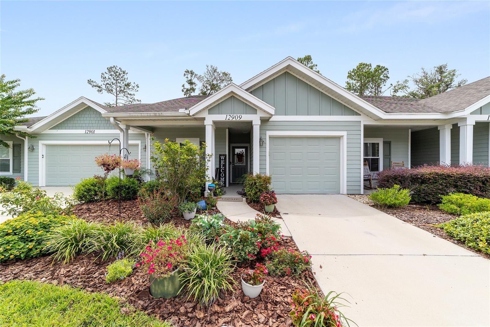 Welcome to Villas of West End, where style, comfort, and convenience come together. This 2 Bedroom, 2 Bathroom Townhome PLUS an Office/Flex space (complete with frosted French doors) offers over 1,500 square feet of thoughtfully designed living. Originally built in 2019 as a Custom- Kara Bolton Model home, it showcases upgrades and details that set it apart. Step inside to find Luxury Vinyl Plank flooring throughout—No Carpet anywhere! The Open-concept layout features a spacious Great room with a tray ceiling, perfect for both living and dining. The Chef’s kitchen is a standout with SS appliances, Granite countertops, tiled backsplash, recessed lighting, and a breakfast bar for casual dining. The huge Primary suite overlooks the private backyard greenery and includes an En suite bathroom with a walk-in shower, plus a large walk-in closet that connects directly to the laundry room. The Split floor plan offers privacy, with a secondary bedroom and bathroom on the opposite side of the home. Enjoy the Florida lifestyle year-round from the screened-in back patio, taking in serene views of the expansive green space and nature. Additional highlights include a covered front porch, beautifully landscaped entry, and a one-car garage. Living in Villas of West End means maintenance-free living, with HOA covering exterior and lawn care. Community amenities include two sparkling pools, a clubhouse, outdoor pavilion, tennis and pickleball courts, plus weekly activities and programs for residents. All of this just minutes to the Town of Tioga, Gainesville Health & Fitness, shopping, restaurants, Jonesville, and easy access to I-75. This is the perfect blend of modern finishes, low-maintenance living, and resort-style amenities. Don’t miss your chance to call this move-in-ready villa home!
