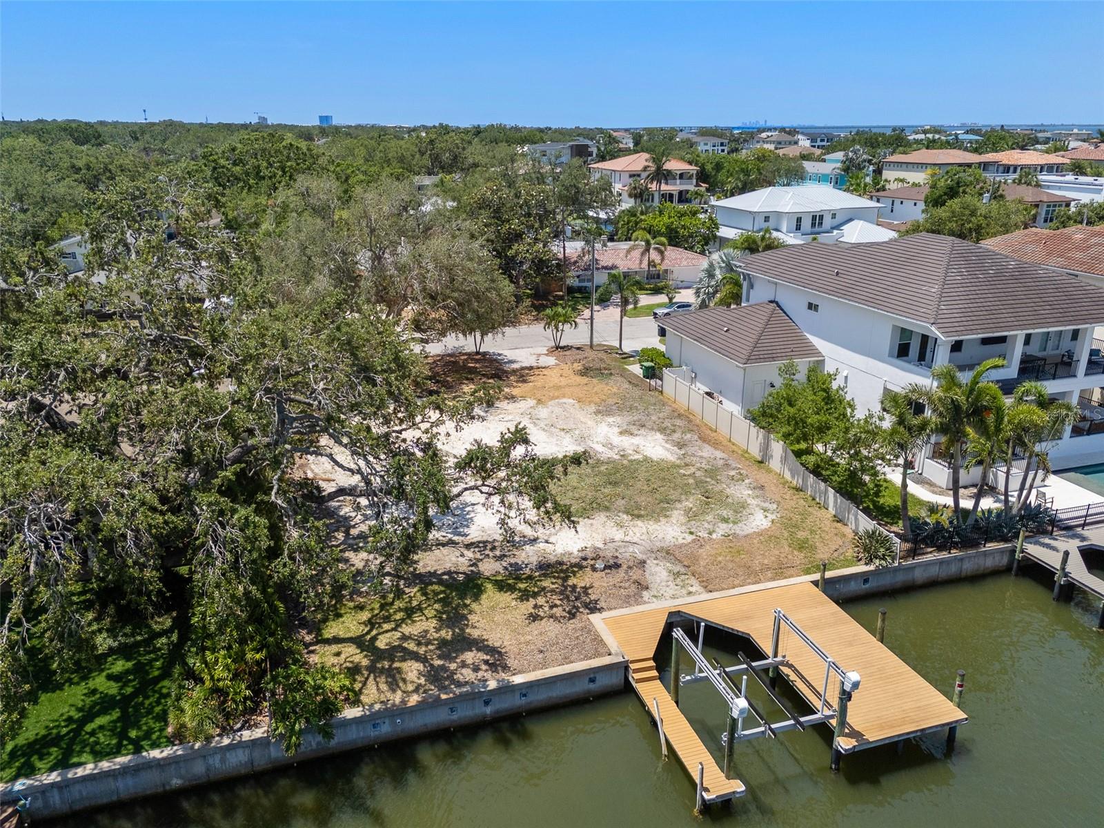 This 82x124 lot (survey attached) is located on a saltwater canal which is wide and leads to open bay (Old Tampa Bay). There is an existing dock and boat lift which has electricity. This is an area with lots of new luxury construction. It is within the Mabry, Coleman and Plant school districts which are all A rated. This Stoney Point location is super convenient to grocery stores (a 6 minute drive to Publix on Dale Mabry), churches, shopping and excellent restaurants. It is a fifteen minute drive to either Tampa International Airport or Downtown Tampa. A great location for a new beautiful home.