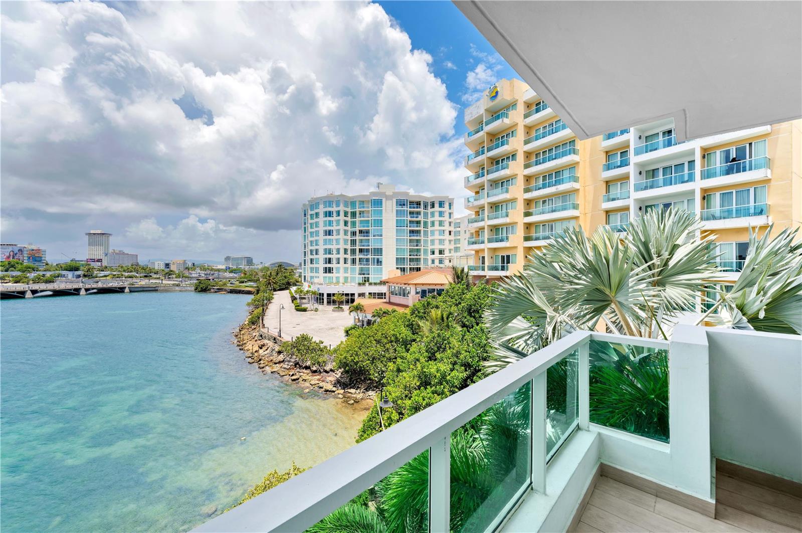 Experience city living with mesmerizing water views as your enviable backdrop within this oceanfront studio apartment at Condado Lagoon Villas. A true coastal-inspired haven with a south-east facing balcony, the 4th-floor home offers the unique option of being used as an income-generating property for either short or long-term rentals. Bright and inviting, enjoy life by the sea at one of San Juan's most coveted locations. Condado Lagoon Villas offers residents top amenities, such as a 24-hr lobby attendant, valet parking, swimming pool and a full-power generator. Indulge in world-class dining and entertainment options at Paseo Caribe and the Caribe Hilton Hotel, minutes away from Old San Juan and Isla Verde. Nestled within a vibrant community that seamlessly blends luxury shopping venues, restaurants, beaches, and a scenic waterfront promenade overlooking the historic Fort San Geronimo, Condado Lagoon, and the Atlantic Ocean.
