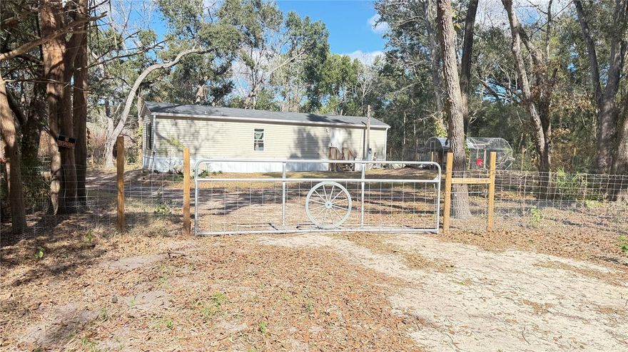 PRICE IMPROVEMENT!! SELLER CONTRIBUTING $5,000 TOWARDS BUYERS CLOSING COST. Welcome to 12992 SE 106th Ct. 2024 year built mobile home! This cozy 2- bedroom, 2 bath home sits on .46 Acre land. NO HOA OR LOT RENT. This move in ready features a NEW WELL, NEW SEPTIC TANK AND HVAC SYSTEM. Vinyl and carpet flooring. Fully fenced yard for privacy. Carney island 1.5 miles away, also endless dining and shopping options, short drive to the villages entertainment. Whether you love fishing, boating, you'll find within 2 hours access to multiple inland lakes. About 15 miles, east coast and west cost beaches. Quite Property set in a cul-de-sac tucked away from city lights, land just developed awaiting finishing touches, feeling of solitude yet retains easy access to civilization. Great starter home for a new family or investment opportunity in a growing area. Call today to make this home yours!