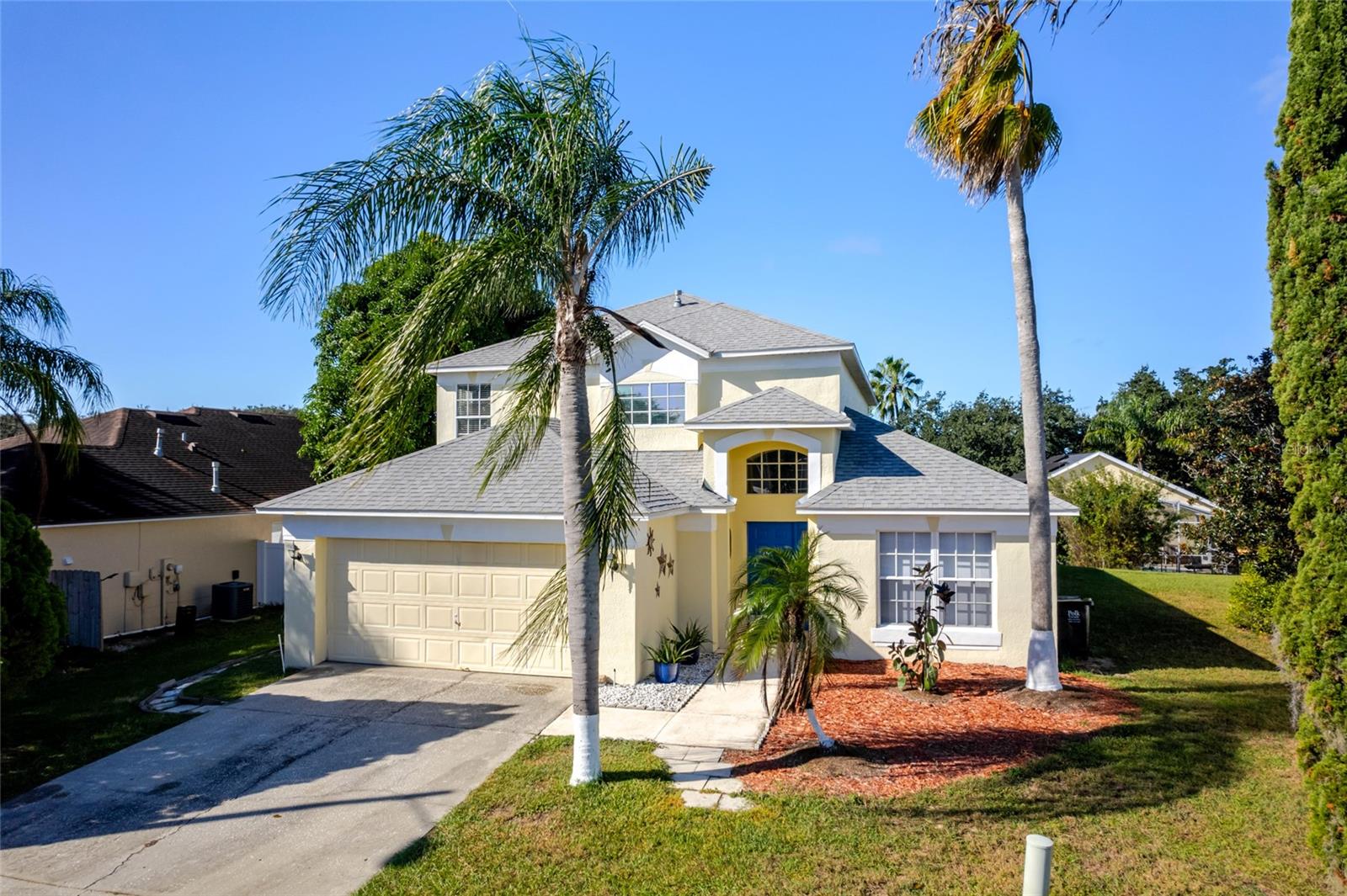 Welcome to 113 Santana Place and the charming community of the Manors at Westridge. This highly sought after community stands out from the rest in the area because of all the extras! A community pool, sand volleyball court, pickleball, tennis court, playground, and basketball court are within footsteps of your front door! This home is the biggest floor plan in the community and includes 5 bedrooms and 3 baths at 2200 square feet. This home has all the upgrades done and is move-in ready including a BRAND NEW ROOF! From the minute you step inside you are captivated by the tall vaulted ceilings, fresh paint, upgraded flooring and the abundance of natural light. The lot is also rare because you have extra space, great for a fire pit or outdoor kitchen and entertaining area. A well-manicured lawn creates great curb appeal and makes this home STAND OUT. Please note that there are TWO bedrooms on the first floor, which is also super rare! This makes it easy for those who don’t like stairs! The open floor plan is exactly what you are looking for and especially when you have a view and easy access to the backyard pool and patio. You actually have PATIO space. Leave the door open and enjoy the sounds of the pool because the entire pool area is screened in. Great to sit out, cook out and eat outside. A separate dining room is available for great family dinners and gatherings. Pay close attention to the pictures that were just taken. Especially the floors. It is also important to mention that the two-car garage has been painted and refreshed. The community is close to dining, shopping, grocery and medical. It is also close to all the theme parks and beaches that Central Florida is famous for. This home CAN BE full-time, part- time or a Vacation Home for Rental. Welcome home!
