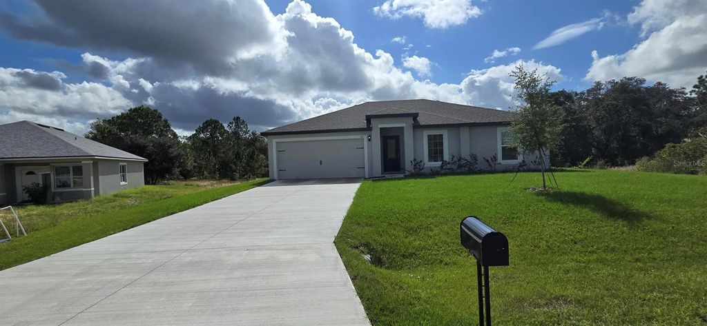 Photo of 310 Amberjack Lane, Kissimmee, FL 34759 (MLS # O6355904)
