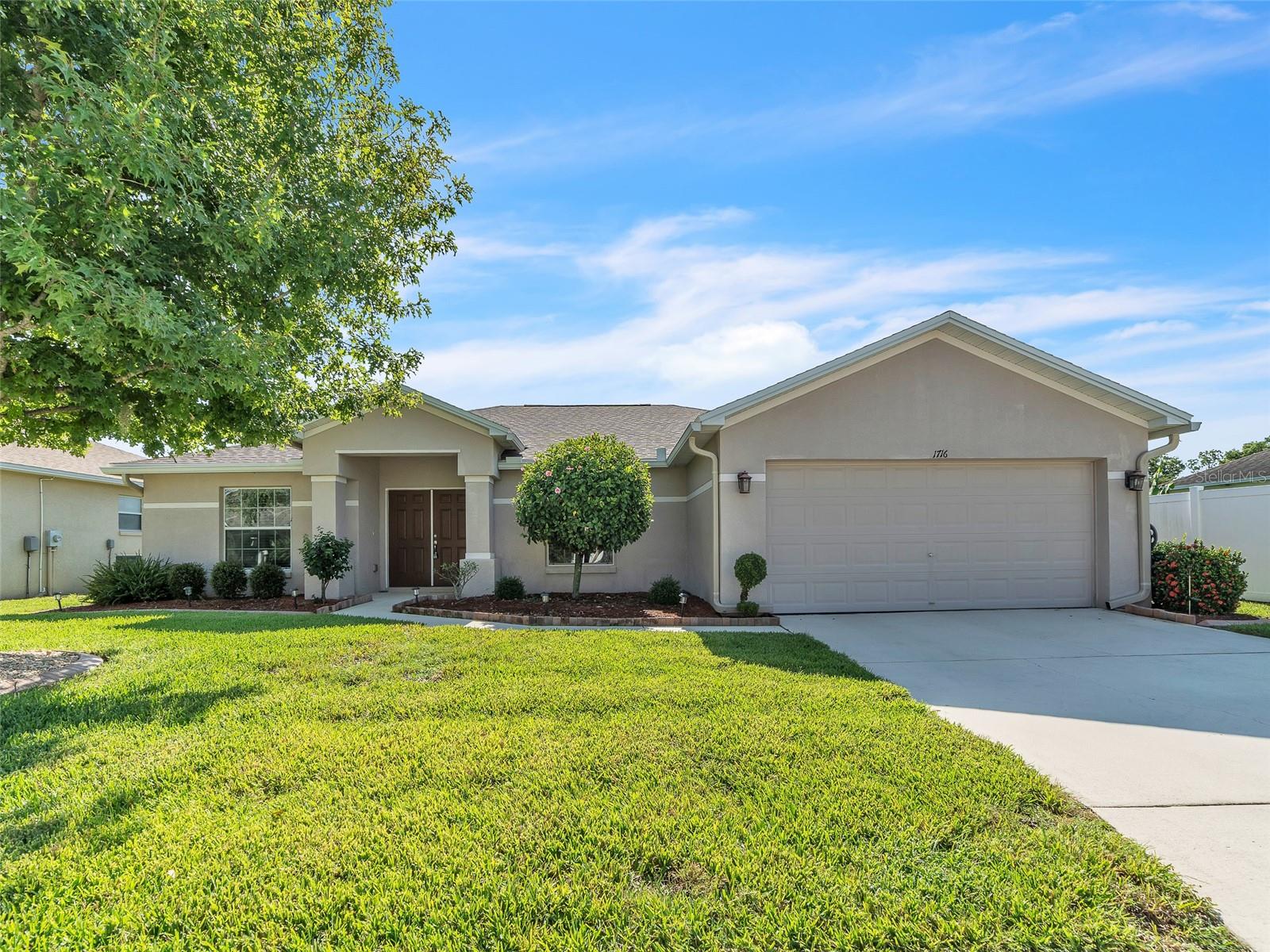 This former model home offers just over 1,800 square feet of comfortable, thoughtfully updated living space. Nestled on an oversized conservation lot with meticulously maintained landscaping, the home welcomes you through elegant double front doors into an open, light-filled living area. Located in the highly sought-after Country Club Trails community of Winter Haven.
The remodeled kitchen is a chef’s dream—with gleaming quartz countertops, a tasteful backsplash, modern drawer cabinetry with spacious 36" drawers, and a brand-new microwave. A separate dining room creates a graceful setting for gatherings, while the flowing layout ties every living space together seamlessly.
Your private primary suite is a serene retreat, featuring tray ceilings, large dual walk-in closets, and an ensuite bath with split vanities and a generous walk-in shower. Two additional well-appointed bedrooms lie on the opposite side of the home, offering comfort and privacy.
Recent upgrades include luxury vinyl plank flooring in the living room, a new dining room rug, gutters with underground drainage, a water softener, and a roof less than 1 year old. The HVAC system is serviced regularly, giving peace of mind year-round.
Outside, the landscaping is nothing short of stunning—supported by an efficient drip irrigation system, your yard stays lush all year, and a brilliant poinsettia blooms each winter, adding seasonal charm.
Location-wise, this home’s address puts you just minutes from I-4 for easy access to Polk County and beyond. Everyday conveniences like Publix, Walmart, and a variety of restaurants—including cozy local favorites—are close by. Adventure is in the neighborhood, too: LEGOLAND Florida, Peppa Pig Theme Park, Cypresswood Golf & Country Club, and the scenic Chain of Lakes Trail are all just a short drive away.
This home blends charm, thoughtful updates, and a prime location in one compelling package—a truly welcoming place to call your own.