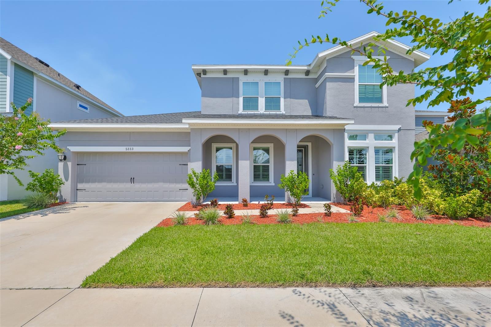 Discover the perfect blend of elegance, comfort, and convenience in this stunning 2023 David Weekley Cecily model home, located in the highly sought-after Waterset community of Apollo Beach. Why wait to build when you can move right into this meticulously crafted residence where resort-style amenities and coastal charm create a lifestyle that feels like a vacation every day. Upon entry, you're welcomed by soaring ceilings and a bright, open floor plan that creates a warm and inviting atmosphere. The gourmet kitchen is thoughtfully designed with stainless steel appliances, quartz countertops, and custom cabinetry ideal for hosting or enjoying family meals. Featuring 4 spacious bedrooms, 3 full bathrooms, over 3,300 square feet of heated living space, and a 3-car garage, it provides ample room for both everyday living and effortless entertaining. The primary suite is a private retreat, highlighted by elegant tray ceilings and a spa-like ensuite bathroom featuring dual vanities, a walk-in shower, a private water closet, and a large walk-in closet. Step outside to your own backyard oasis, where a covered lanai overlooks lush landscaping and borders vacant land offering ultimate privacy with no rear neighbors. Located in the desirable Waterset community, residents enjoy access to top-tier amenities including a resort-style pool, state-of-the-art fitness center, scenic walking trails, and more. With top-rated schools nearby and convenient access to shopping, dining, and entertainment, this home delivers the ideal combination of luxury and everyday convenience. Don't miss this rare opportunity to embrace the Florida lifestyle at its finest. Schedule your private showing today!